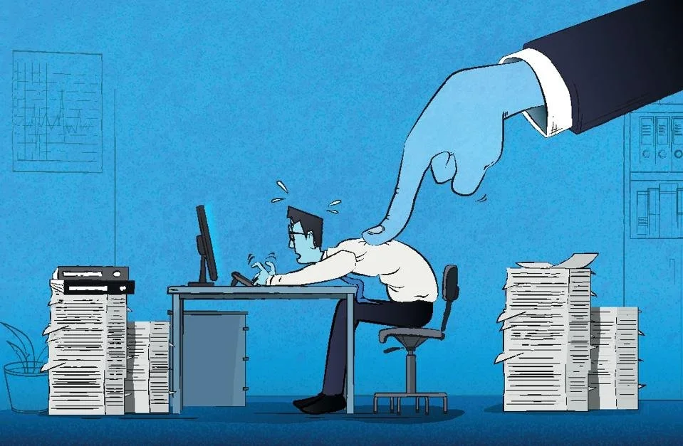 Toxic leader pressuring an employee at a desk, representing harmful workplace culture