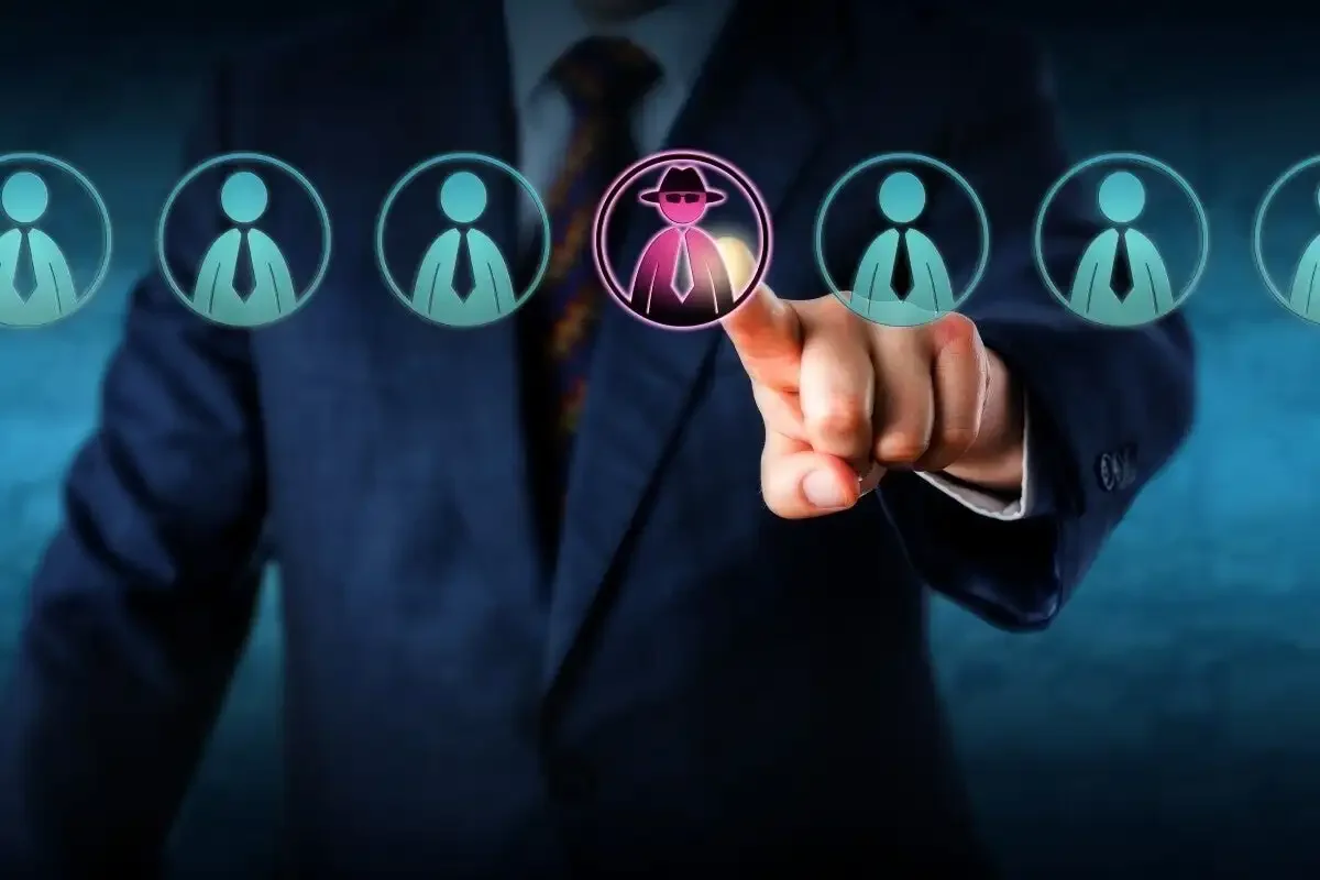 Executive identifying a suspicious insider threat among employees