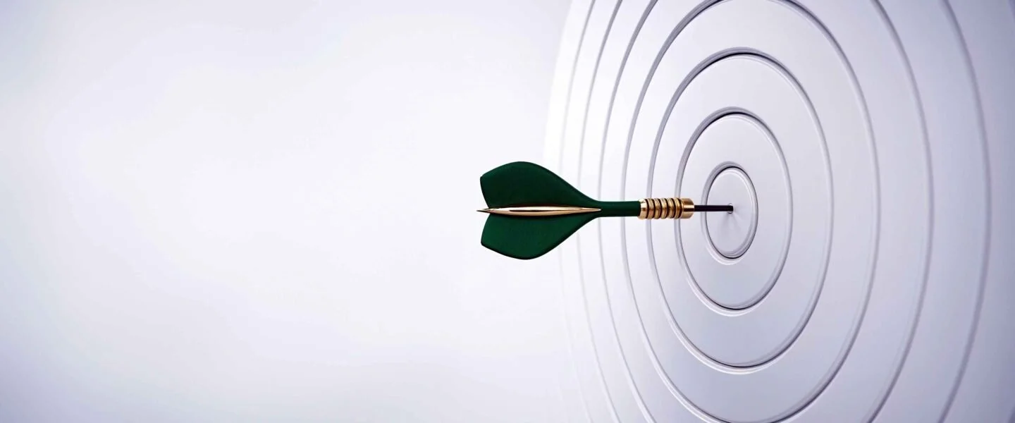 Dart hitting the bullseye of a target, symbolizing leadership clarity and visibility