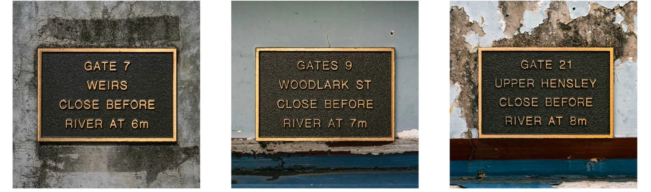 Plaques mark the water level that triggers closure of flood gates