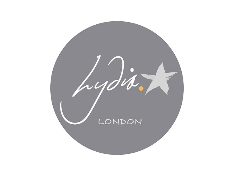 Gray circle logo with the handwritten text 'Lydia' and a small star, with the word 'LONDON' underneath.