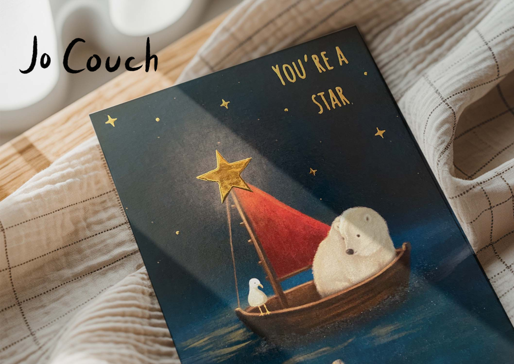 A logo with a pink circle background, black handwritten text that says "Jo Couch," a small bee illustration, and decorative elements like stars and dots around the circle, with the website URL "www.jocouch.com" at the bottom.
