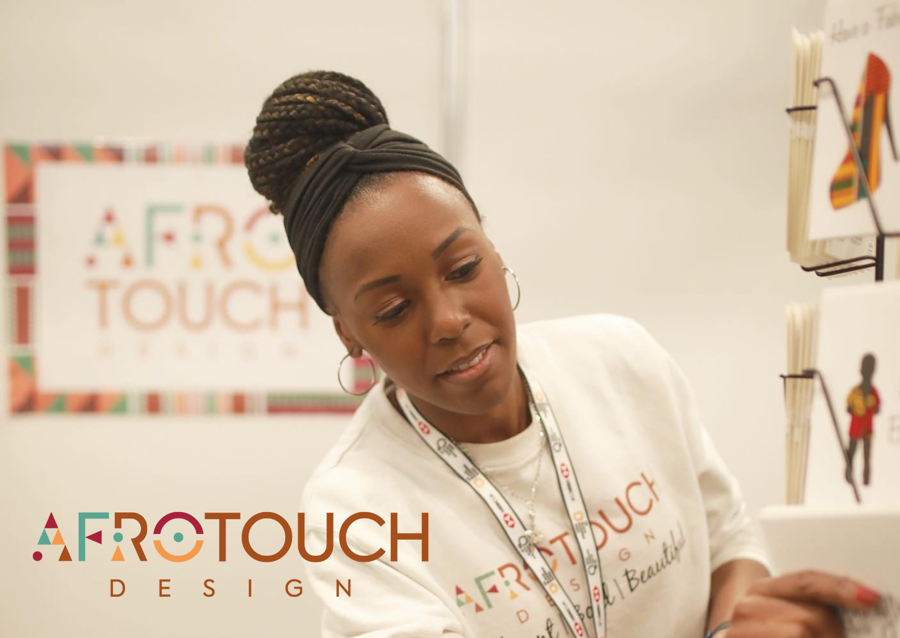 Logo with the words 'Afro Touch Design' in colorful geometric shapes and stylized font.
