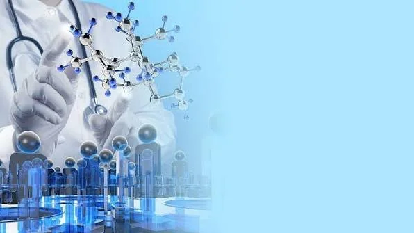 Scientist's hand holding a molecular model with syringes and laboratory equipment in the background.