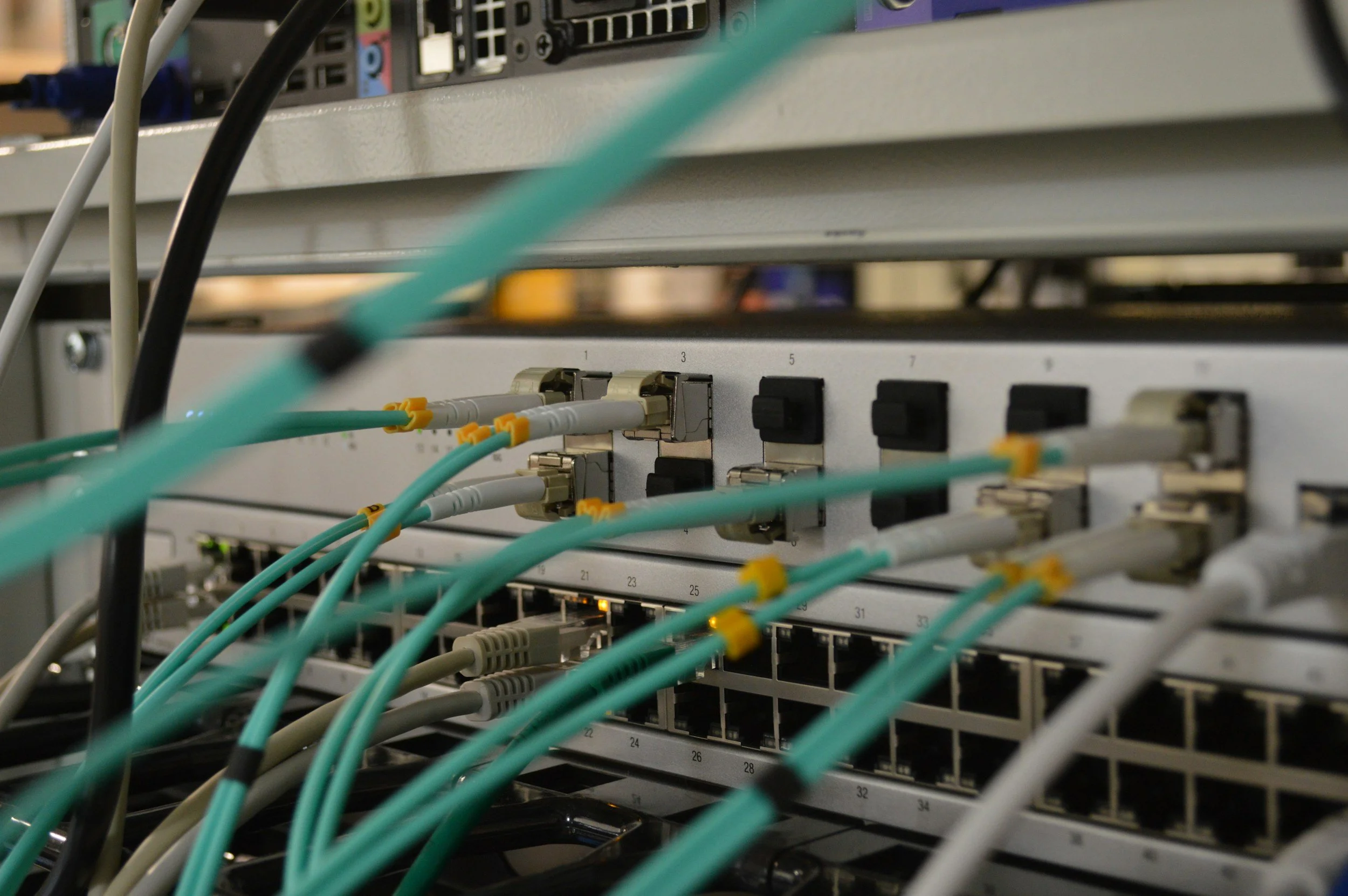 Server with fiber optic and ethernet cables for business continuity