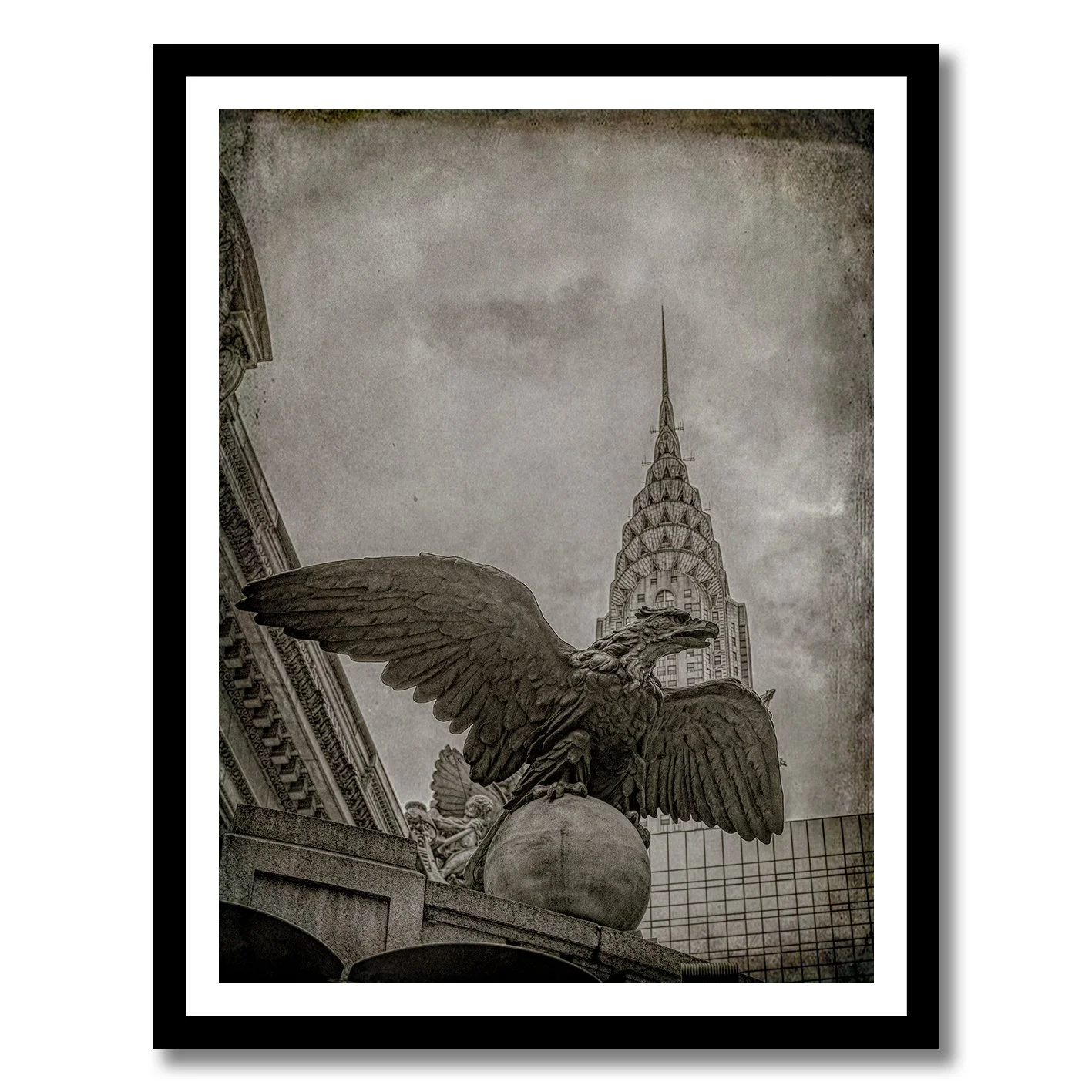 black and white photograph of grand central eagle with chrysler building behind