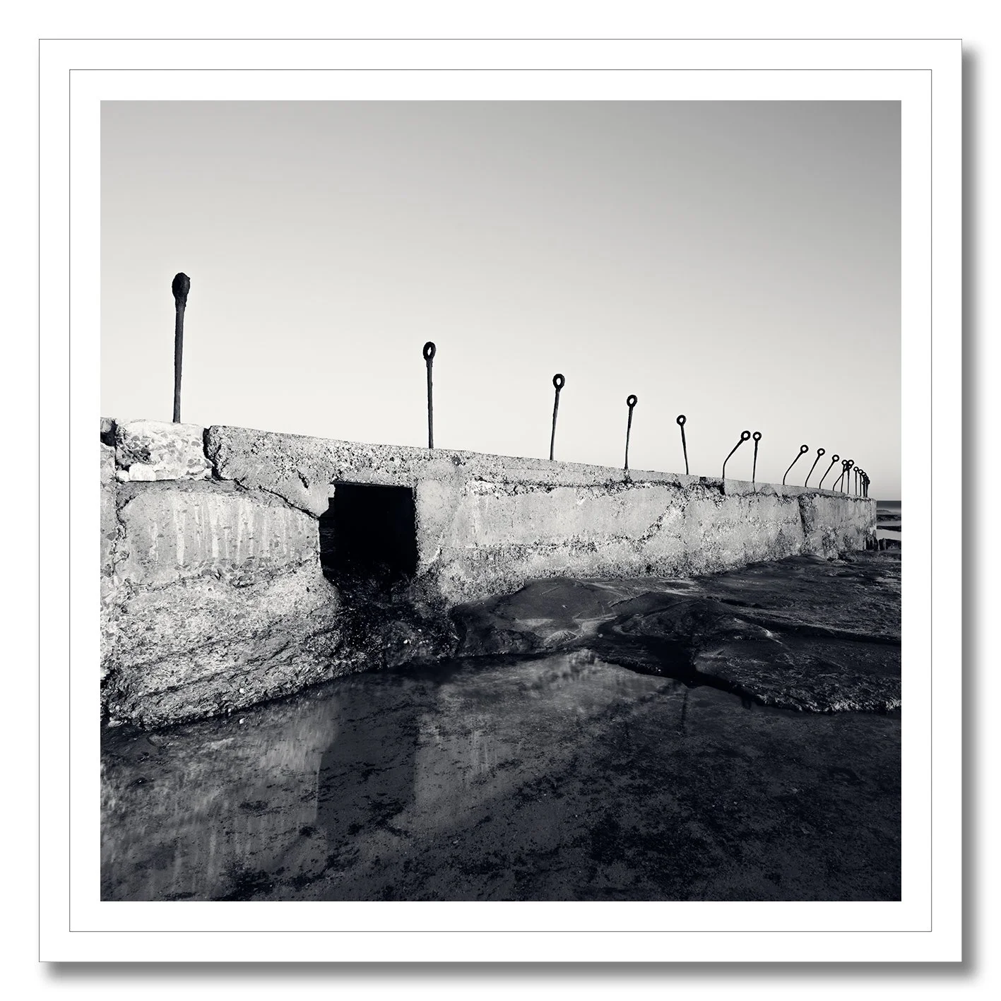 black and white photograph of coastal concrete structure