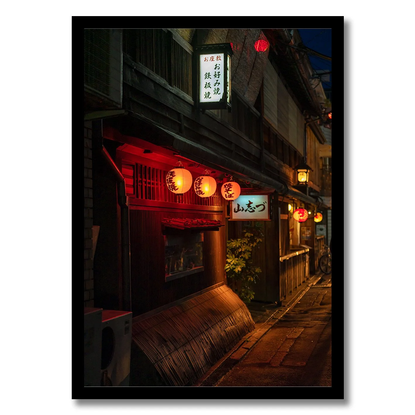 Tokyo night street photograph with glowing red lanterns and traditional buildings