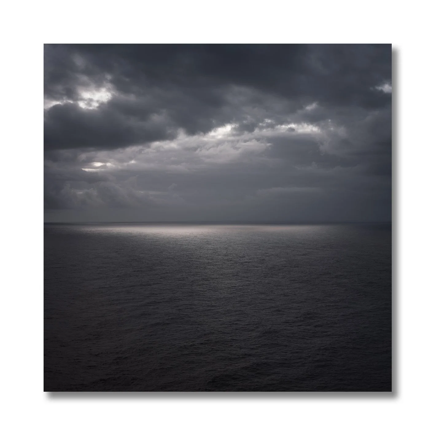 moody seascape photograph of north atlantic ocean under clouds