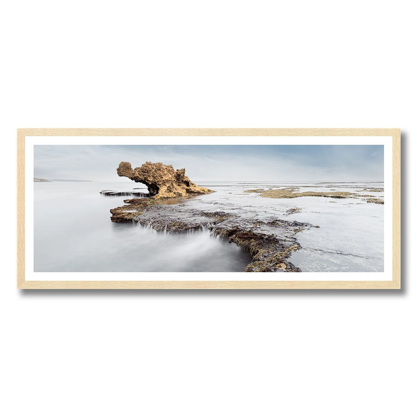 fine art photograph of dragons head rock formation mornington peninsula with soft water motion