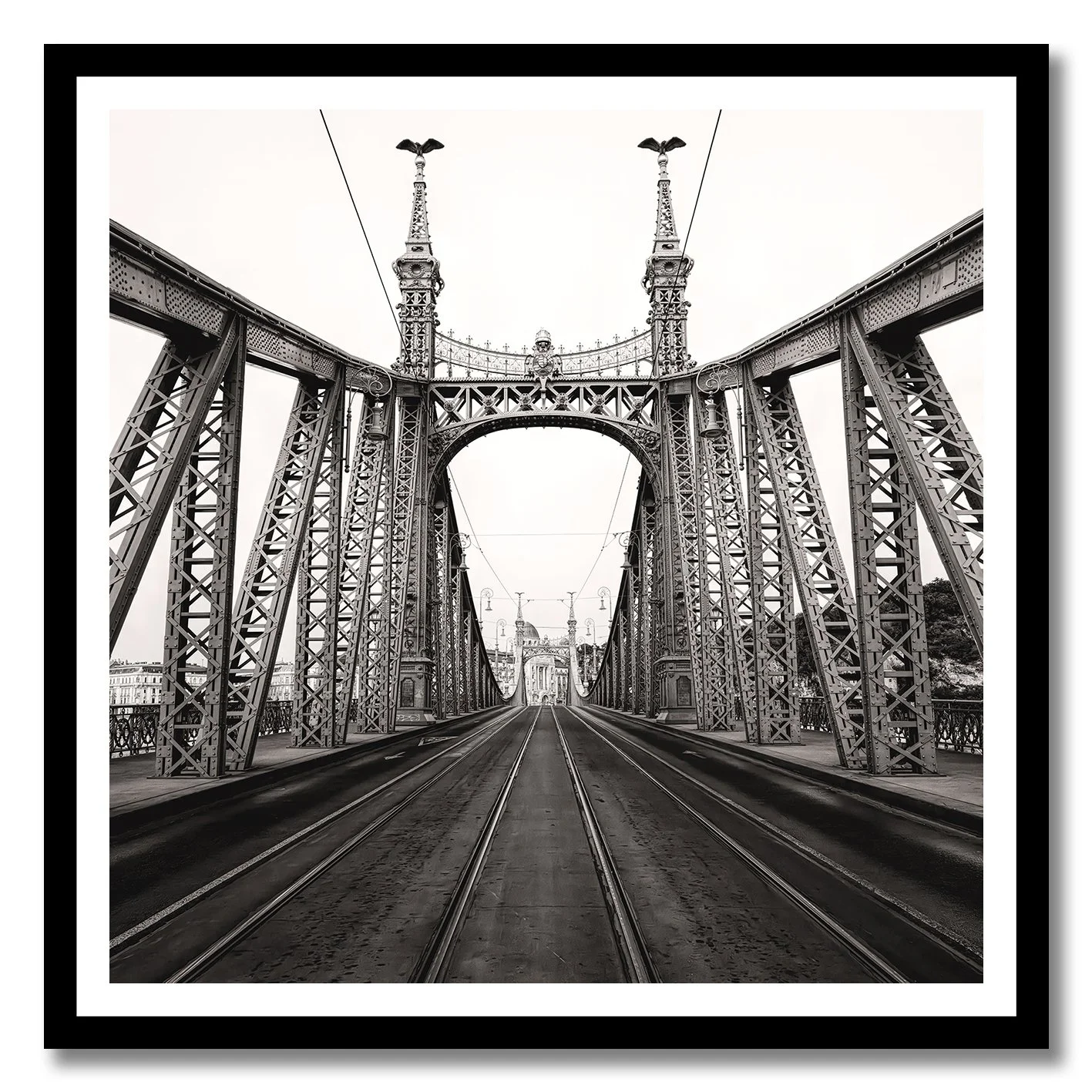 Black and white photograph of Liberty Bridge in Budapest with tramlines