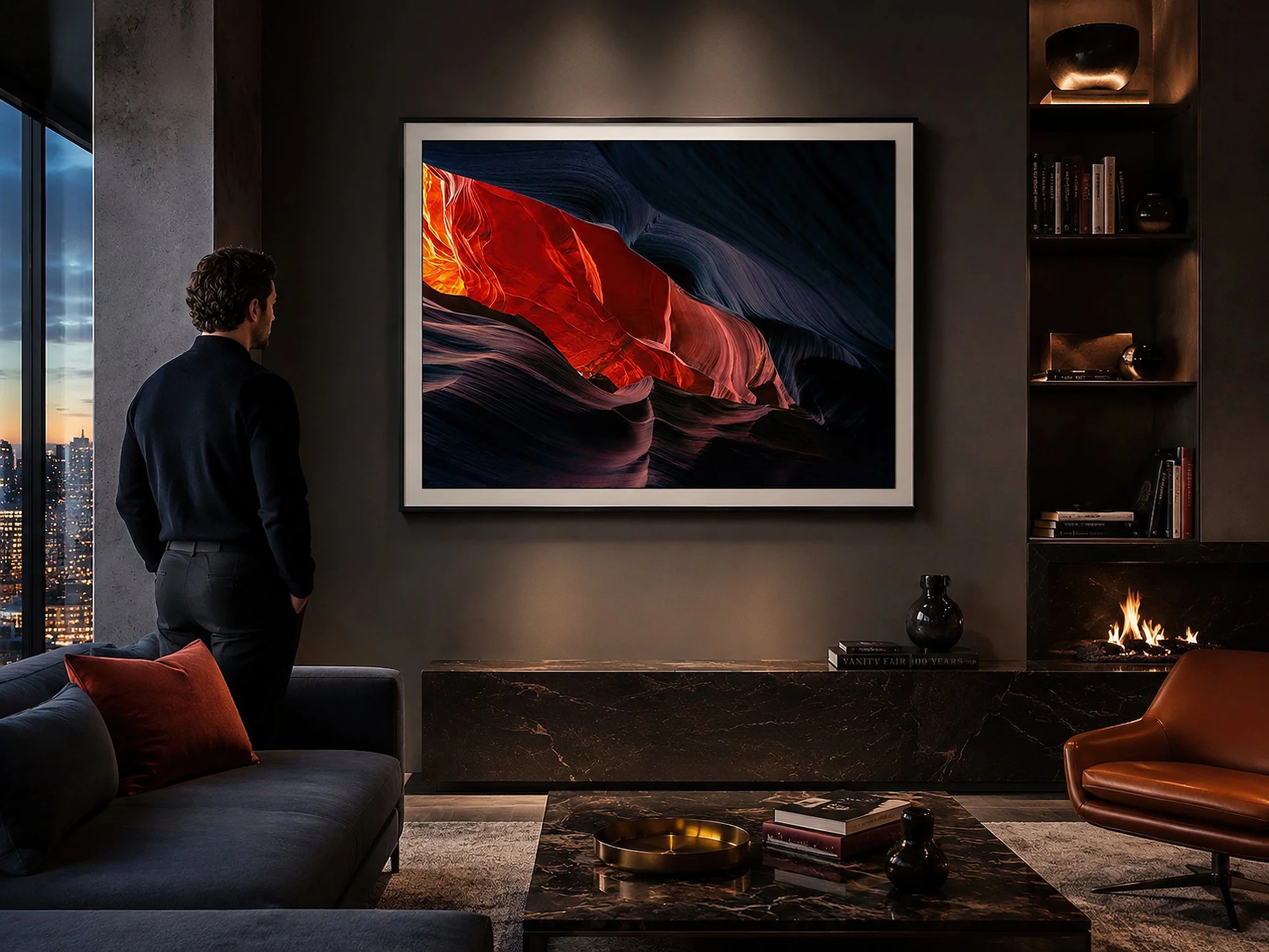 Framed Antelope Canyon photograph displayed in a sophisticated dark living room with a man standing nearby.