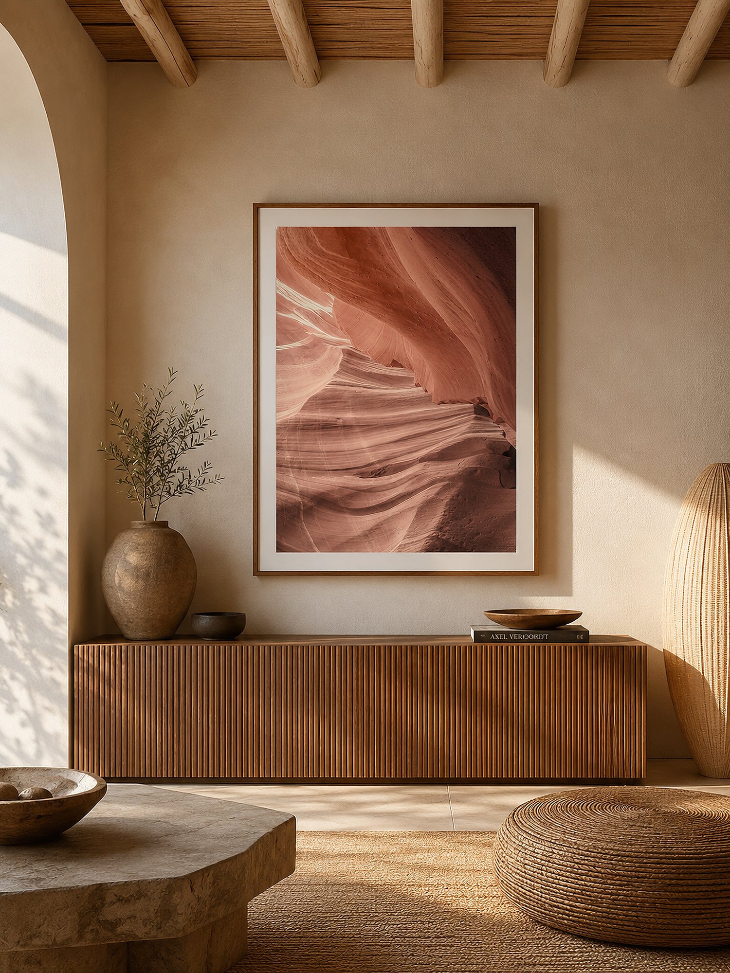 Framed Antelope Canyon photograph displayed in a sunlit Mediterranean-style interior with warm timber furnishings and no people.