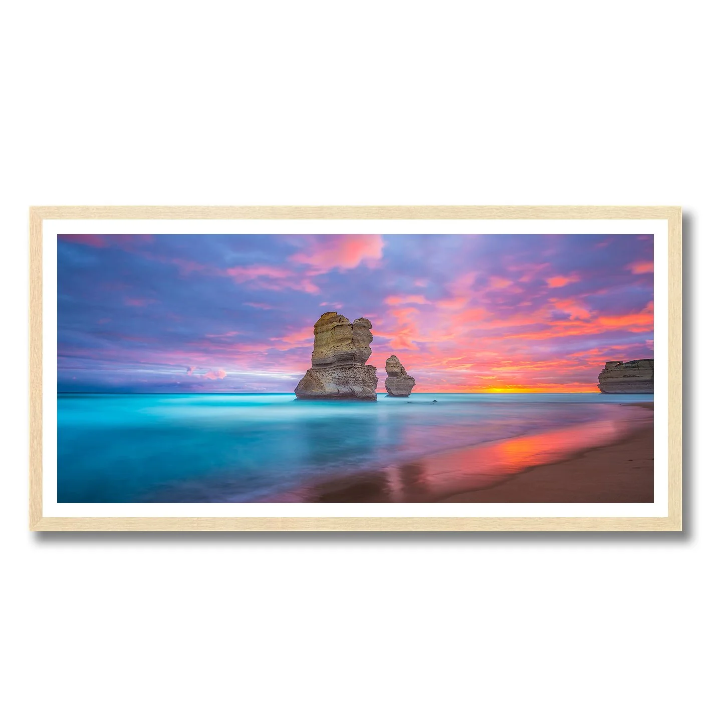 Sunrise over the Twelve Apostles with glowing turquoise sea and colourful sky