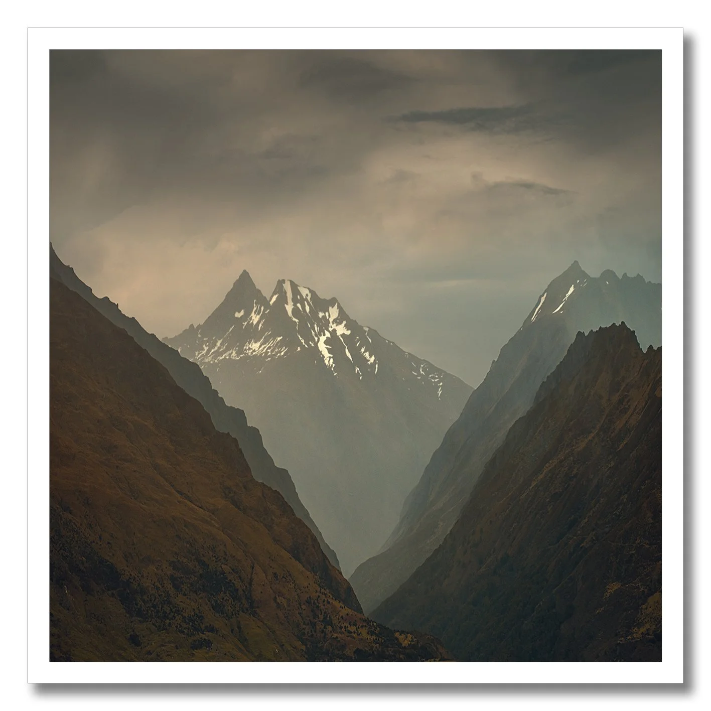 Mountain valley photography with snow peaks in New Zealand
