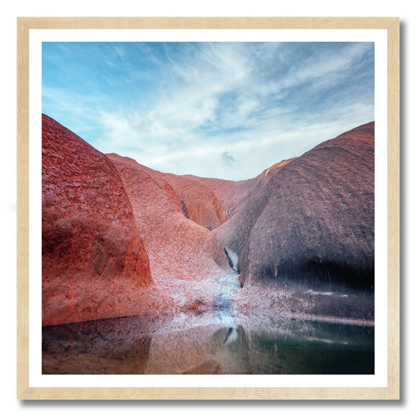 photograph of mutitjulu waterhole at uluru with reflections on still water