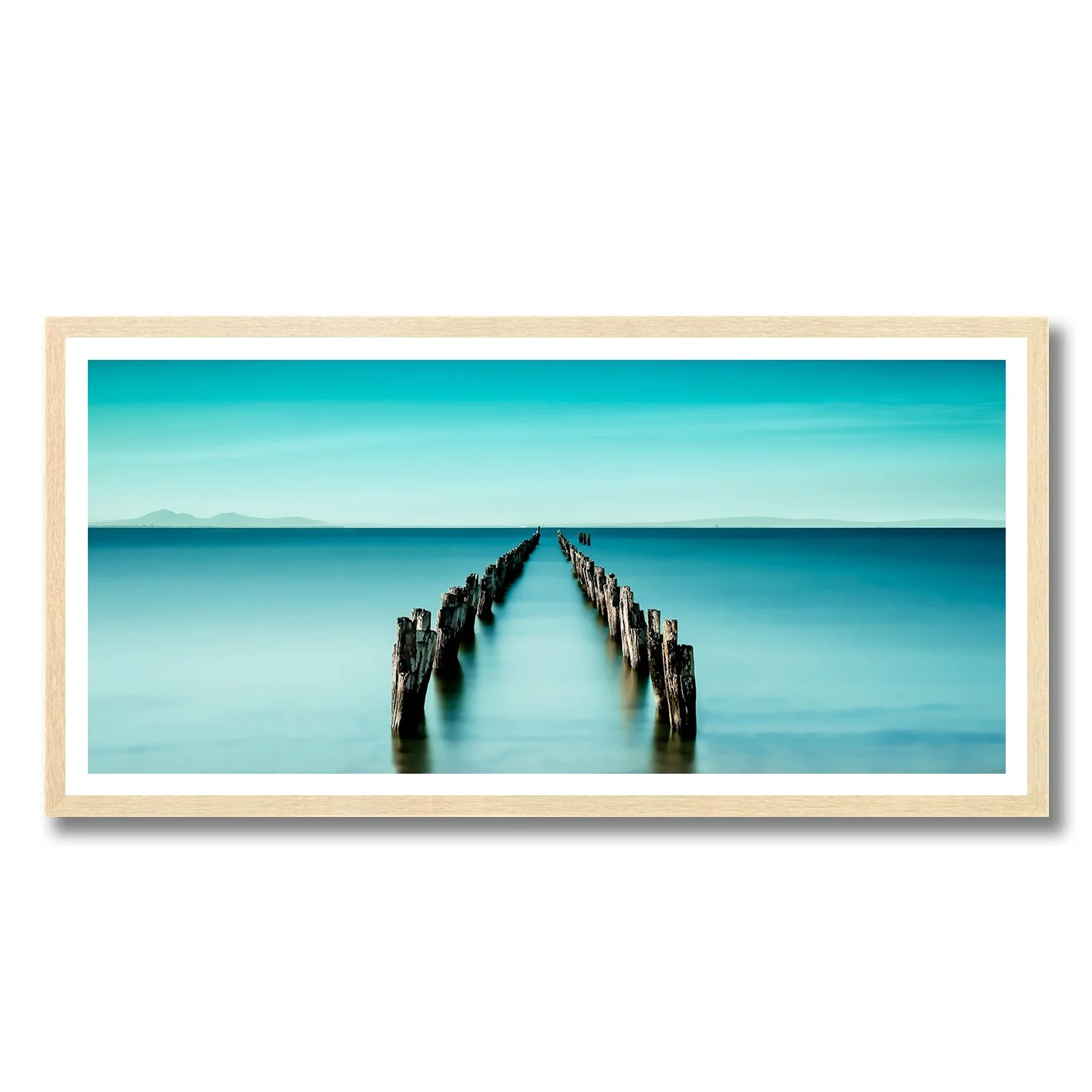 Fine art photography of Clifton Springs pier pylons over calm turquoise water by Nick Psomiadis