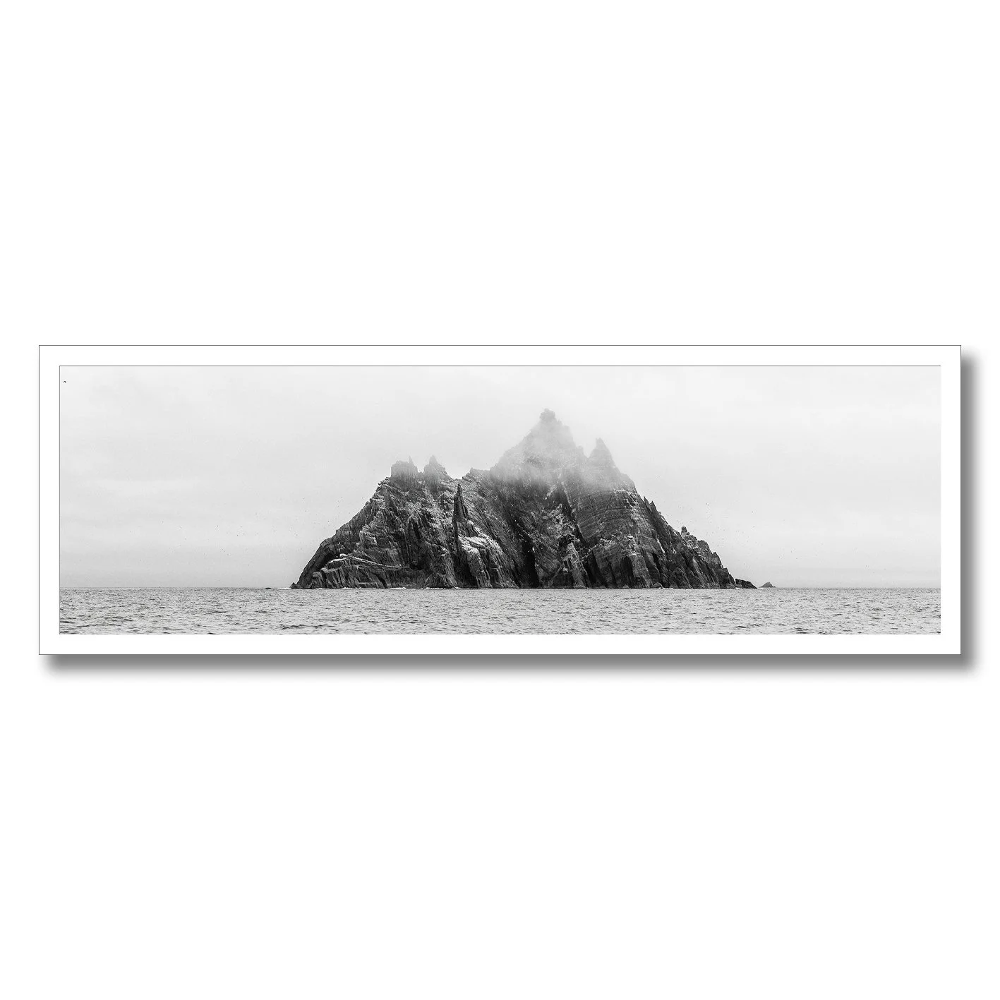 black and white photograph of skellig michael island rising from the atlantic ocean