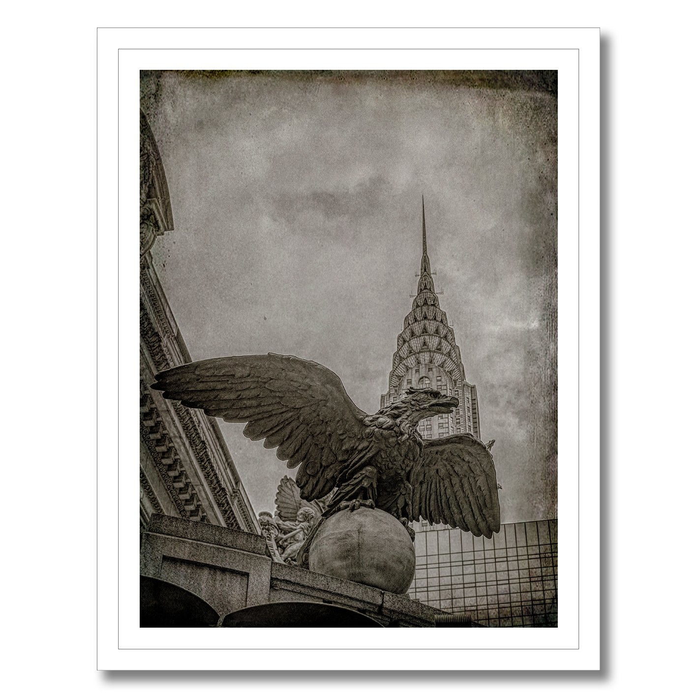 black and white photograph of grand central eagle with chrysler building behind