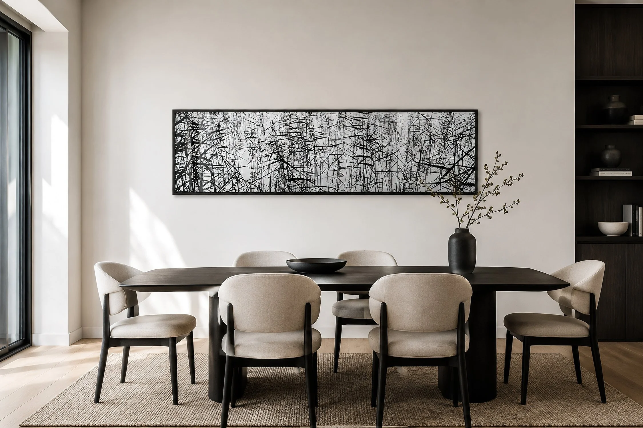 Modern contemporary dining room with a framed Sumi Ashi black and white photograph of layered reeds and reflections, styled with a dark timber table, neutral upholstered chairs and soft natural light, by Nick Psomiadis at NIKART Studio and Gallery