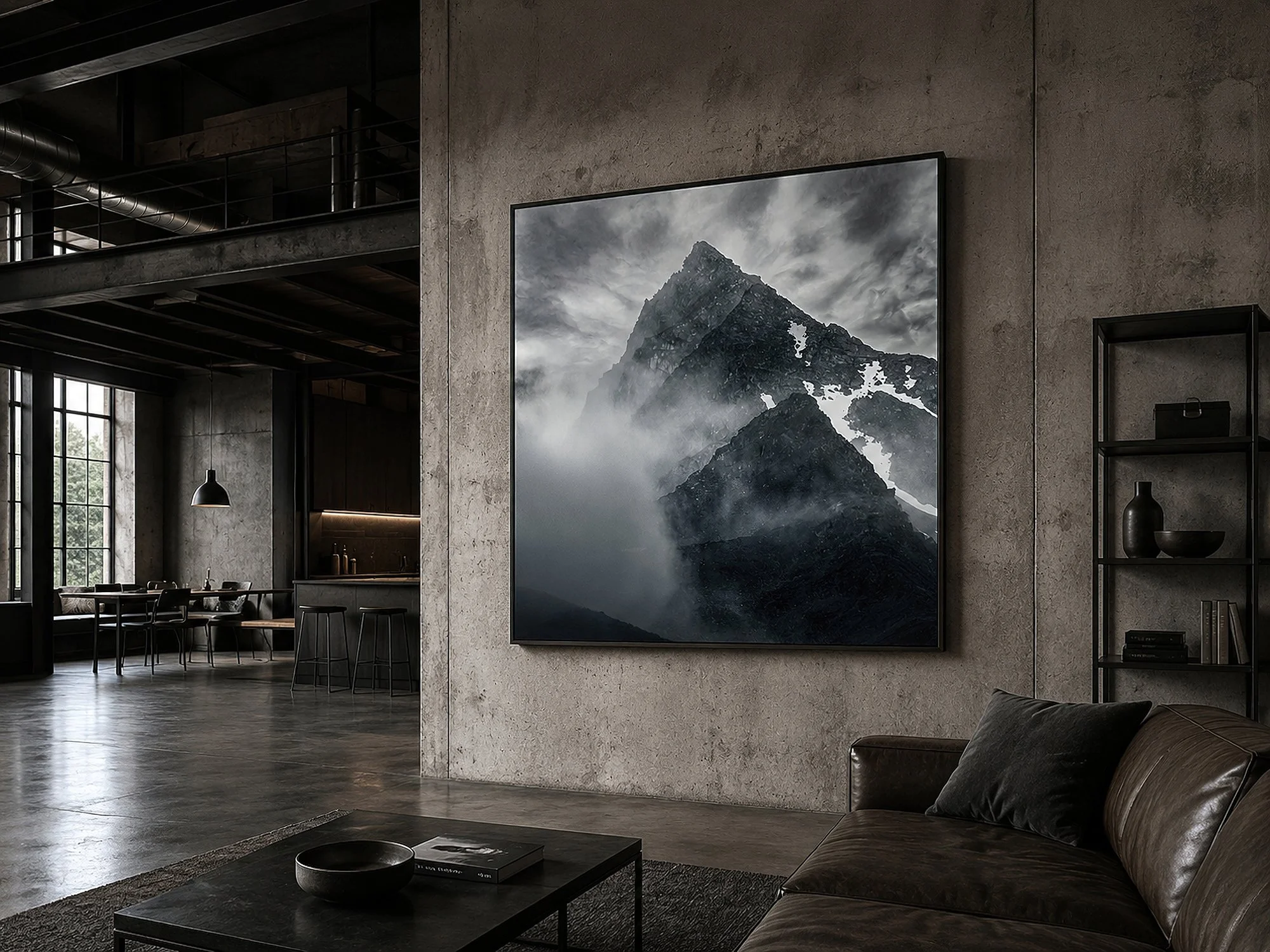 Square mountain canvas print in a slim black frame, displayed in a minimalist warehouse loft with raw concrete walls, exposed steel beams, polished floors and dark leather seating by Nick Psomiadis at NIKART Studio and Gallery