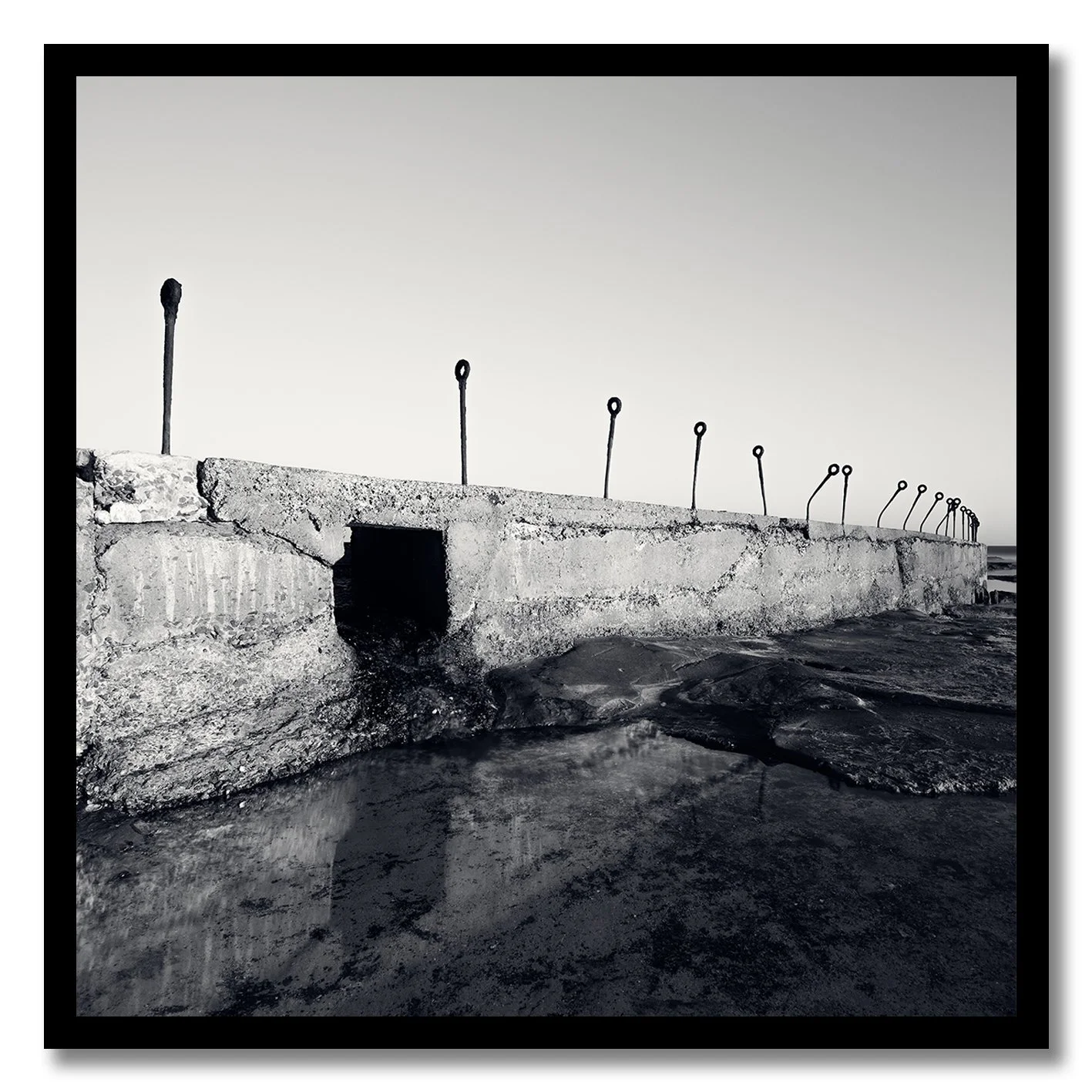 black and white photograph of coastal concrete structure