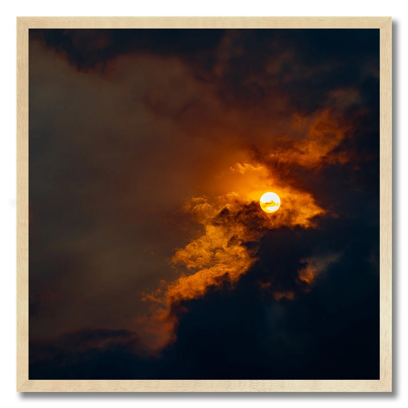 Sun breaking through golden clouds in a dramatic fine art photograph