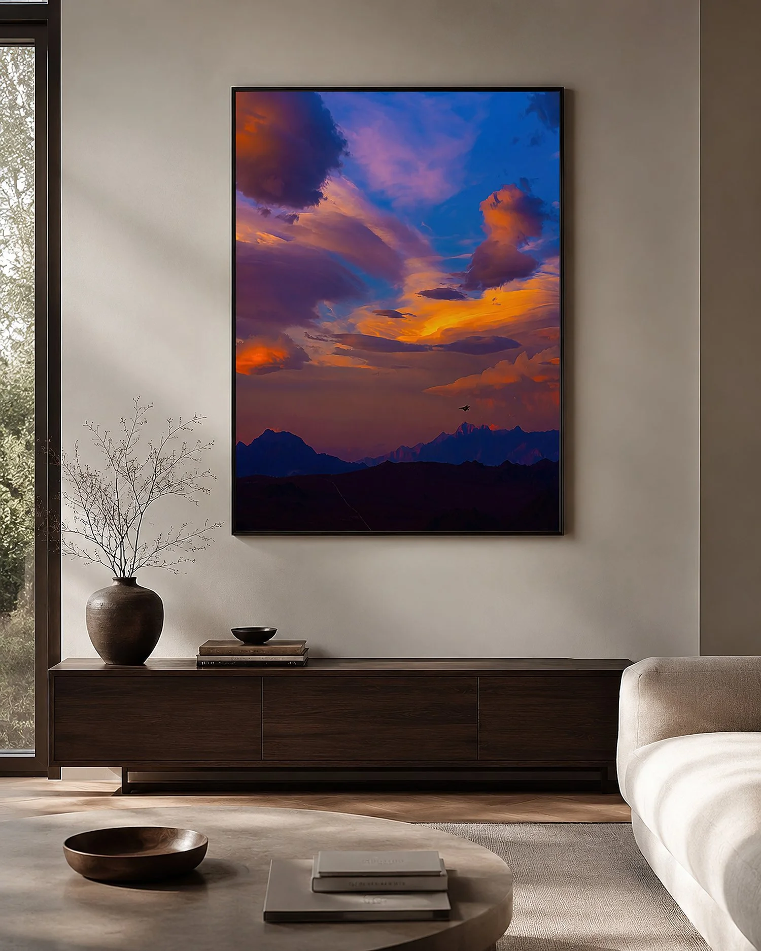 Framed sunset photograph over mountains in a neutral modern living room by Nick Psomiadis at NIKART Studio and Gallery