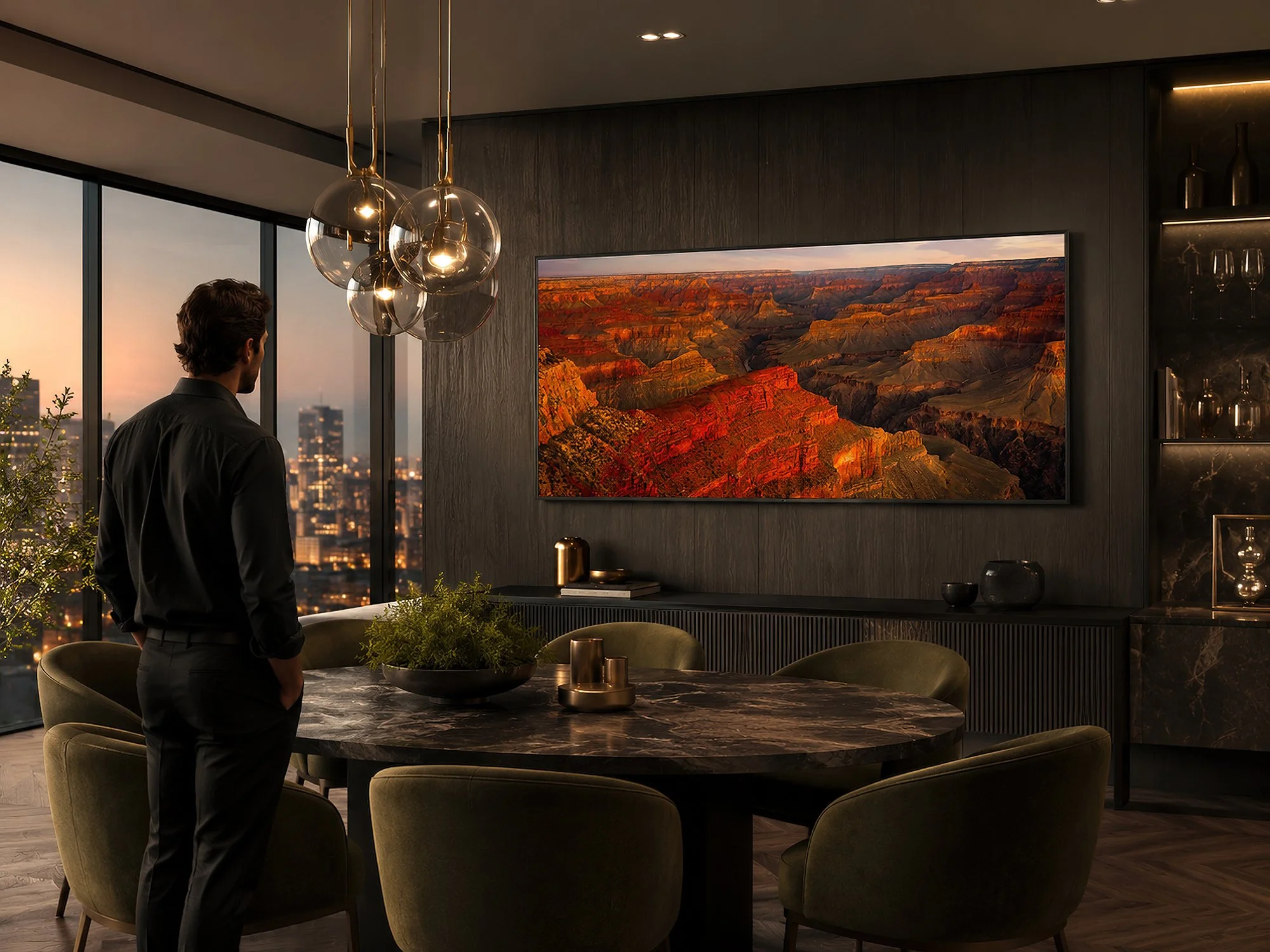 Panoramic Grand Canyon photograph displayed without a border in a dark luxury dining room with a man standing nearby.