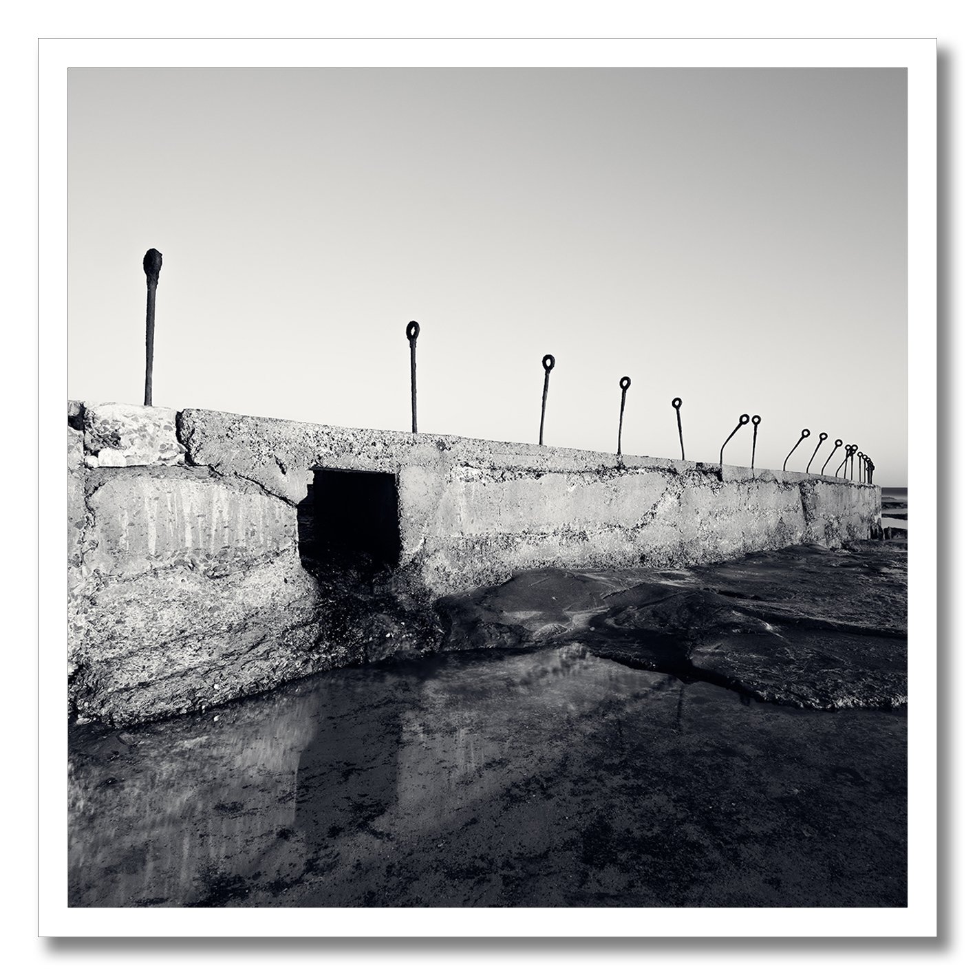 black and white photograph of coastal concrete structure