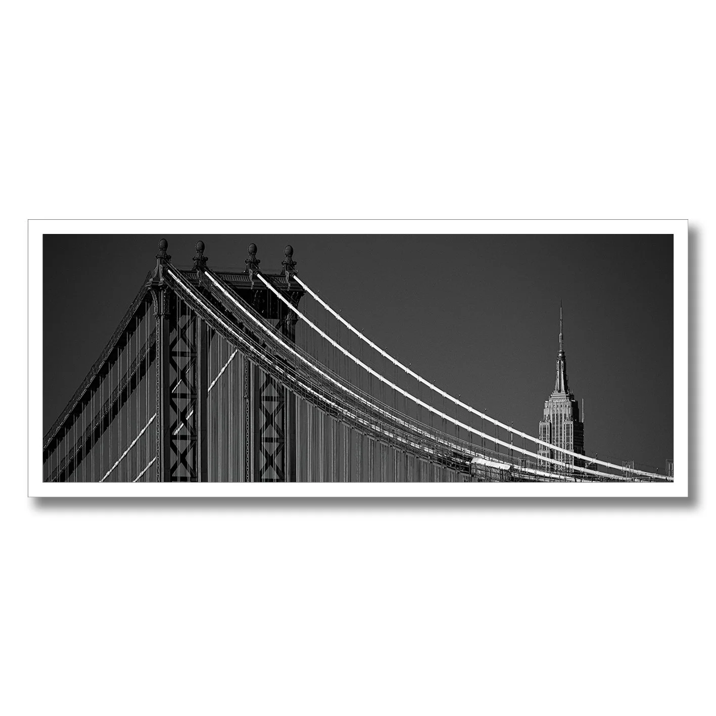 Black and white panoramic photograph of Manhattan Bridge and Empire State Building