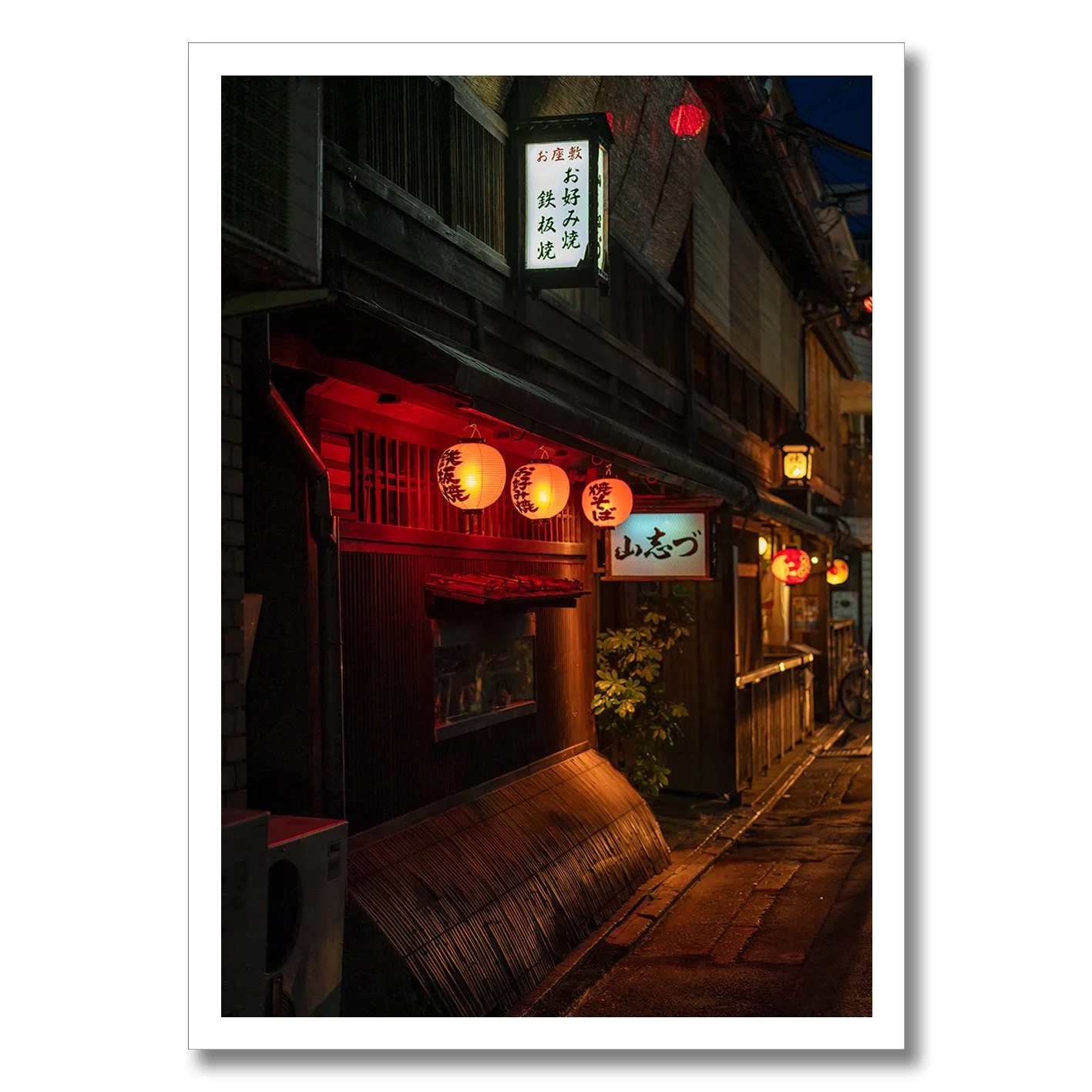 Tokyo night street photograph with glowing red lanterns and traditional buildings