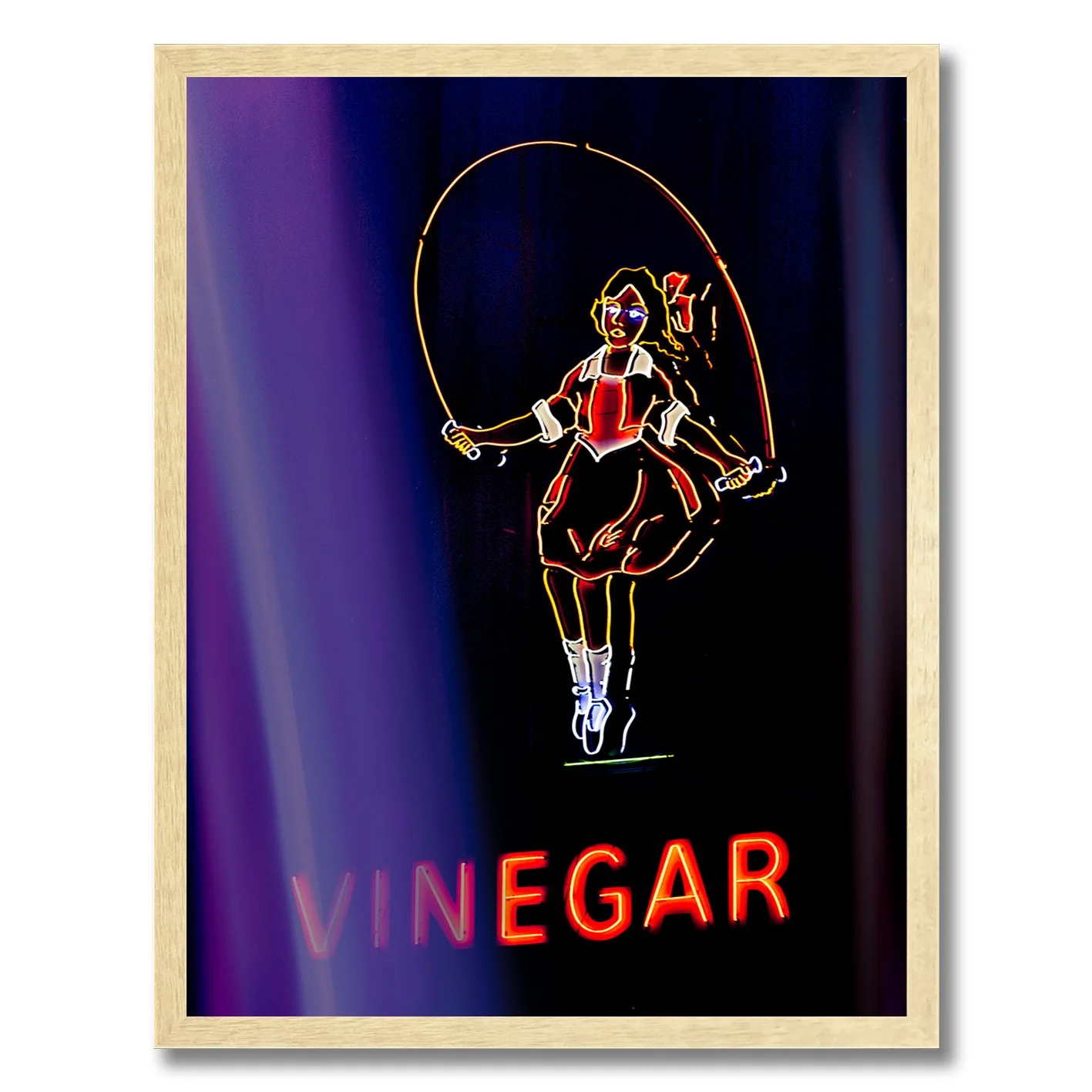 Neon photograph of Skipping Girl sign behind purple curtain light