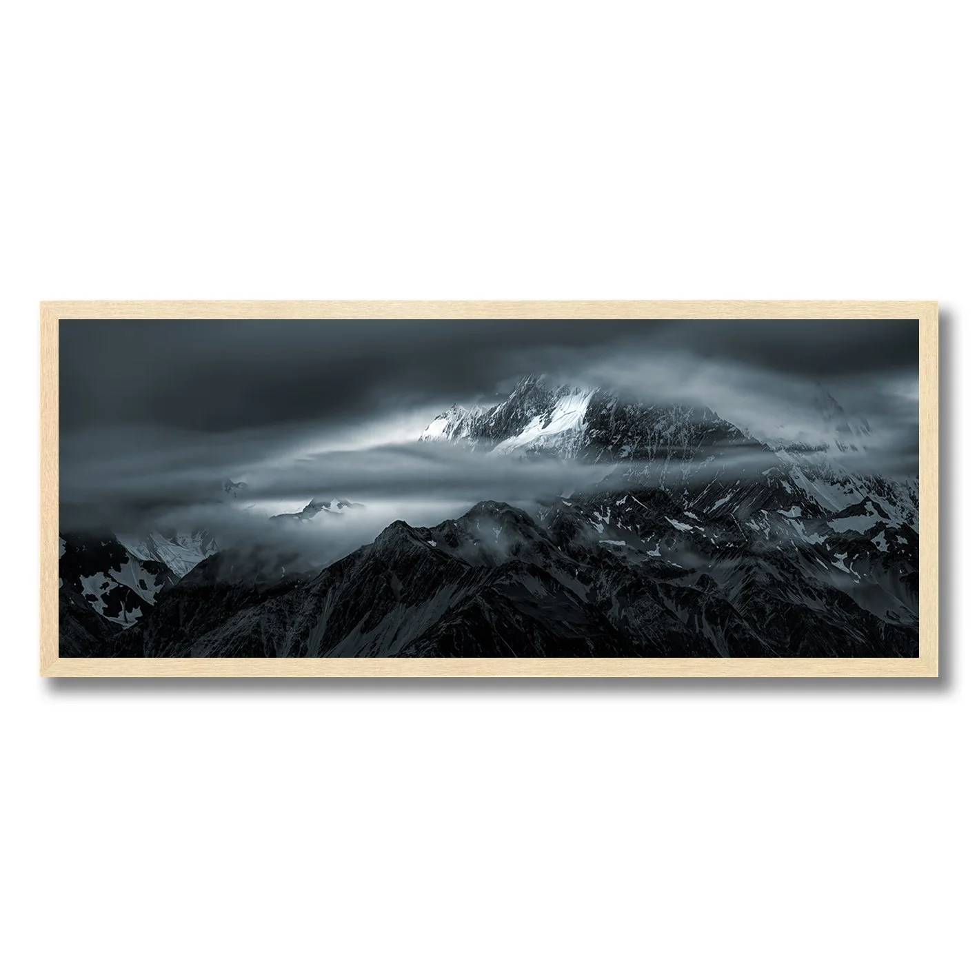Moody photograph of snow-covered Southern Alps and drifting cloud near Glentanner