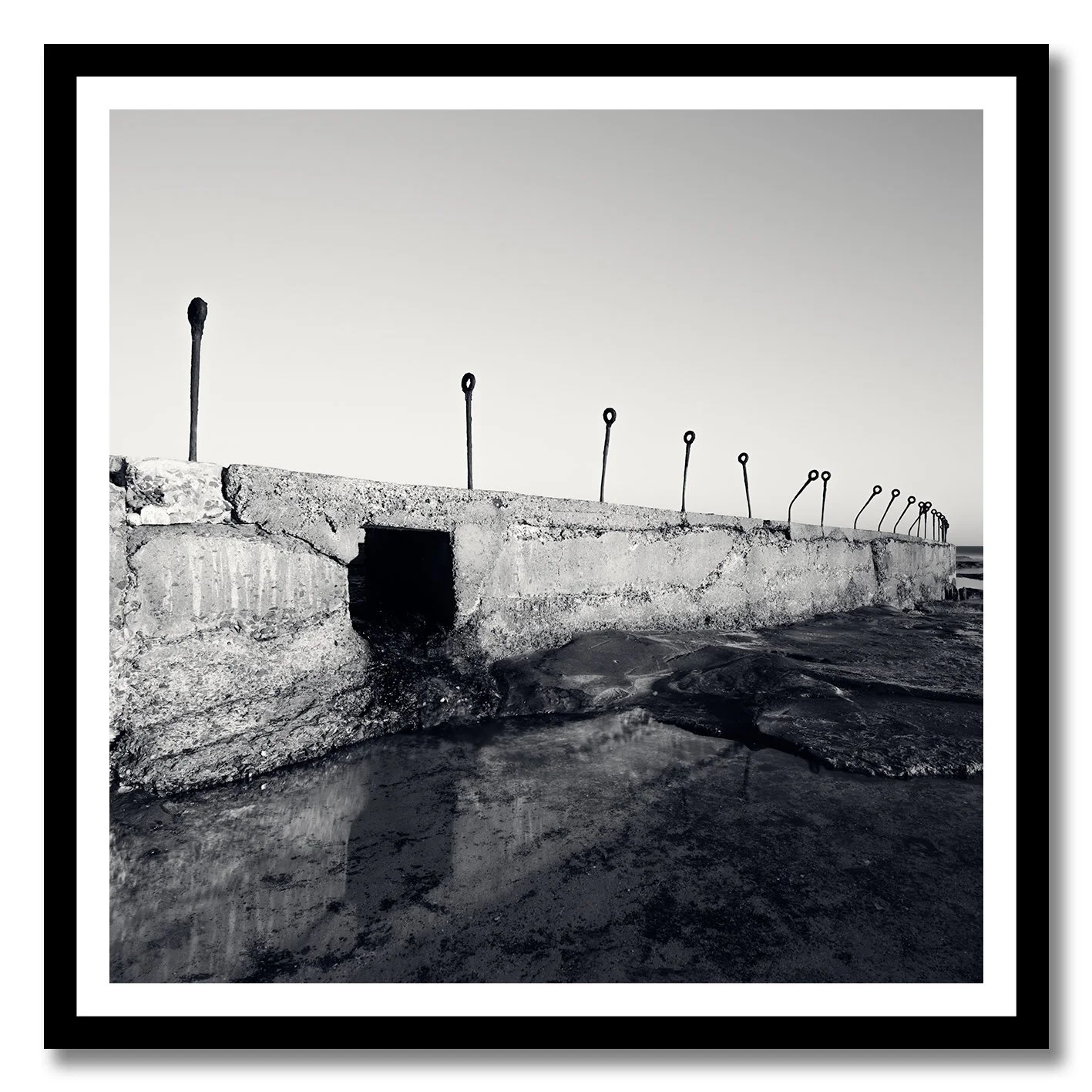 black and white photograph of coastal concrete structure