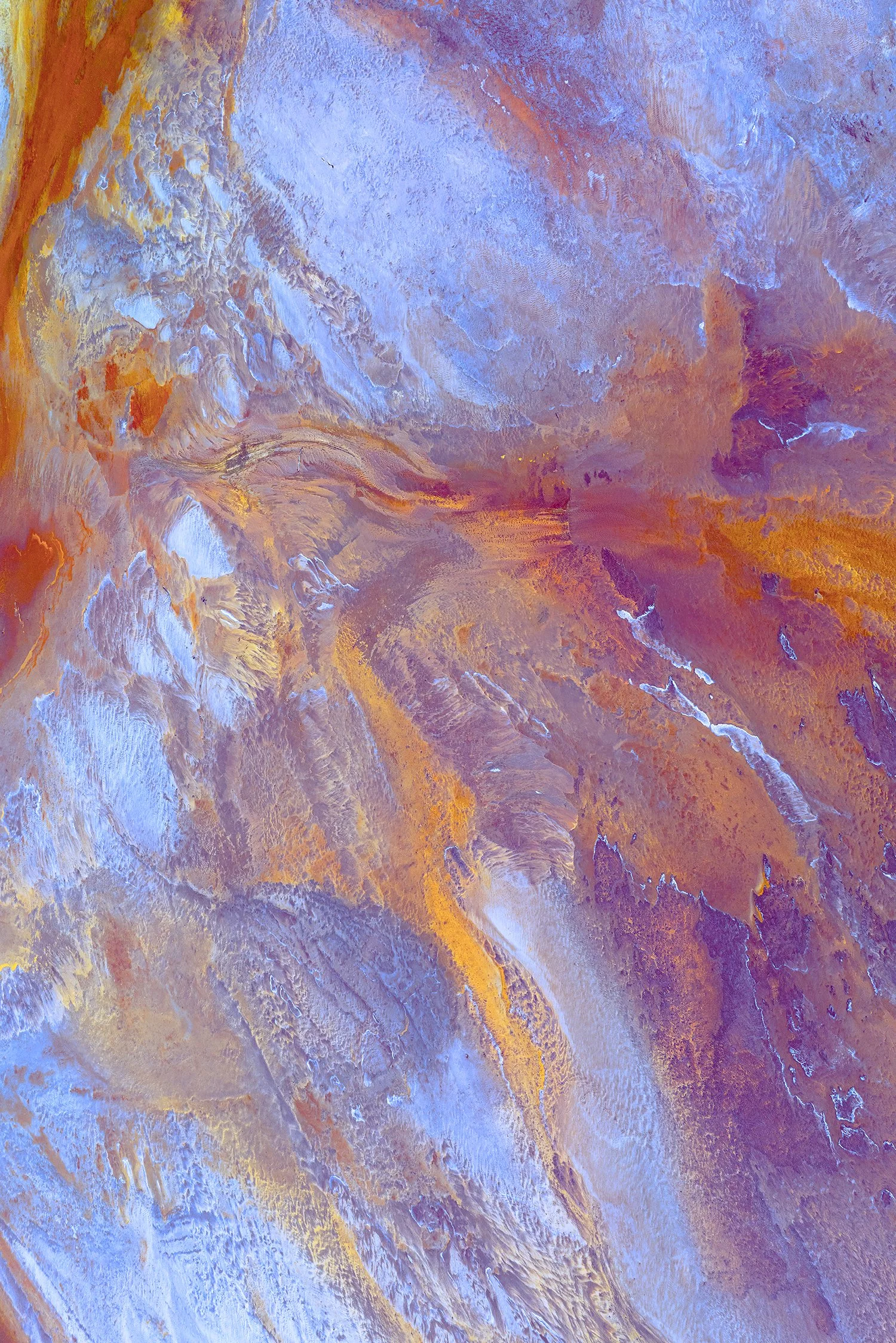 Abstract aerial textures of salt lake with blue and orange tones, fine art photograph