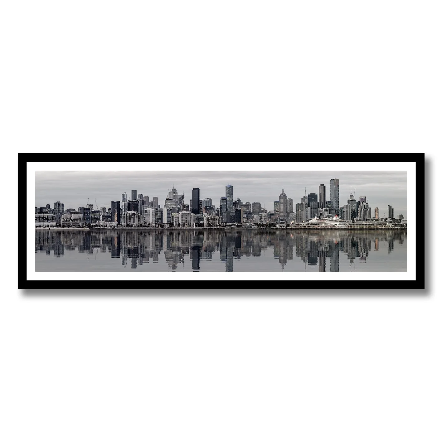 black and white photograph of melbourne skyline reflected on calm water