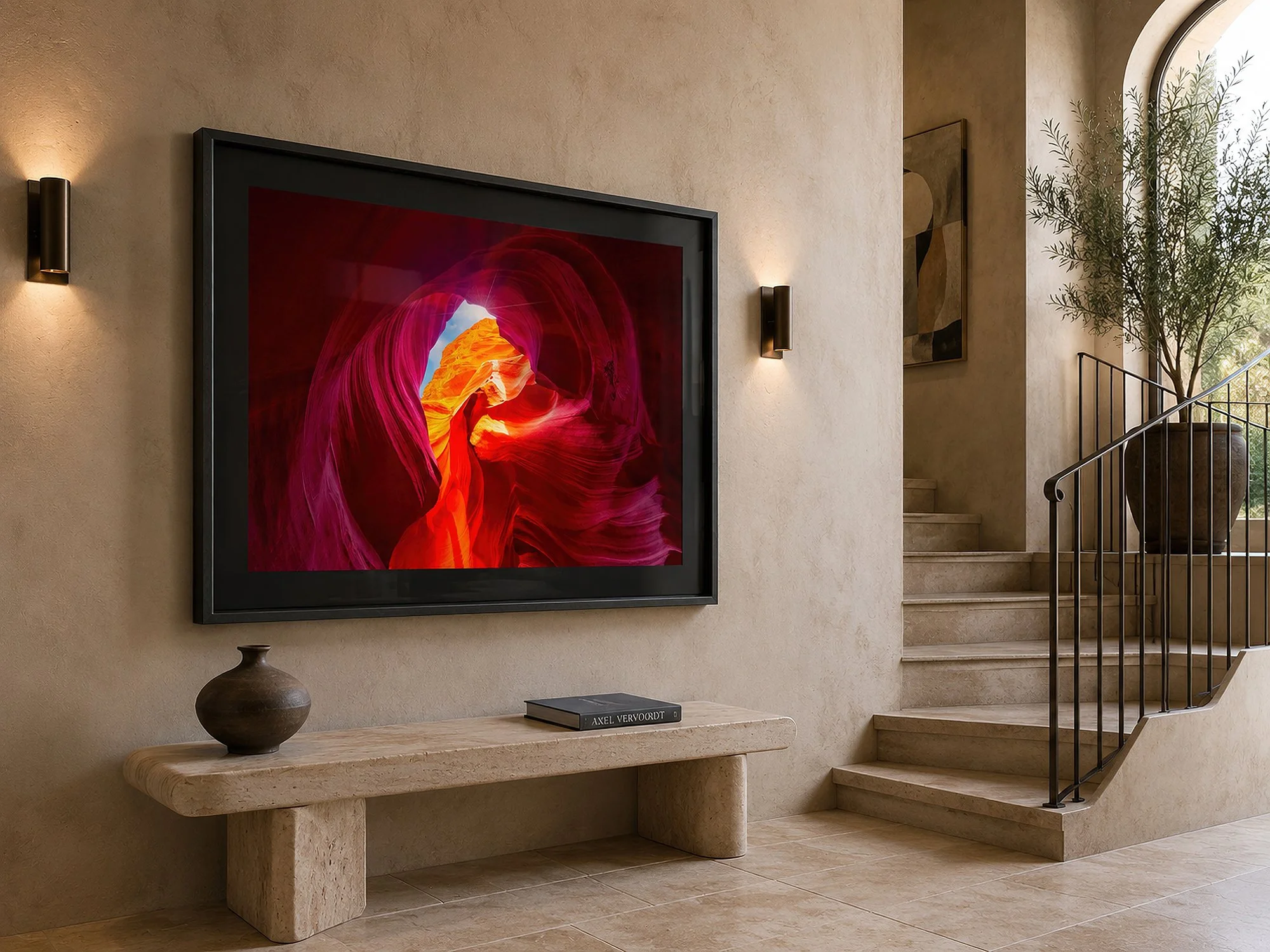 Framed Antelope Canyon photograph with a black mat displayed in a minimalist Mediterranean entryway with stone stairs.