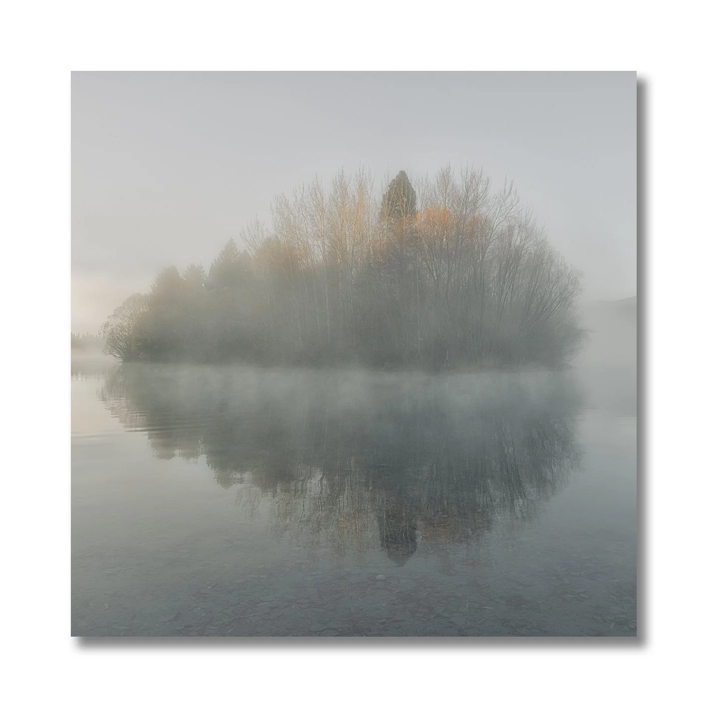 photograph of misty island reflection on lake in twizel new zealand