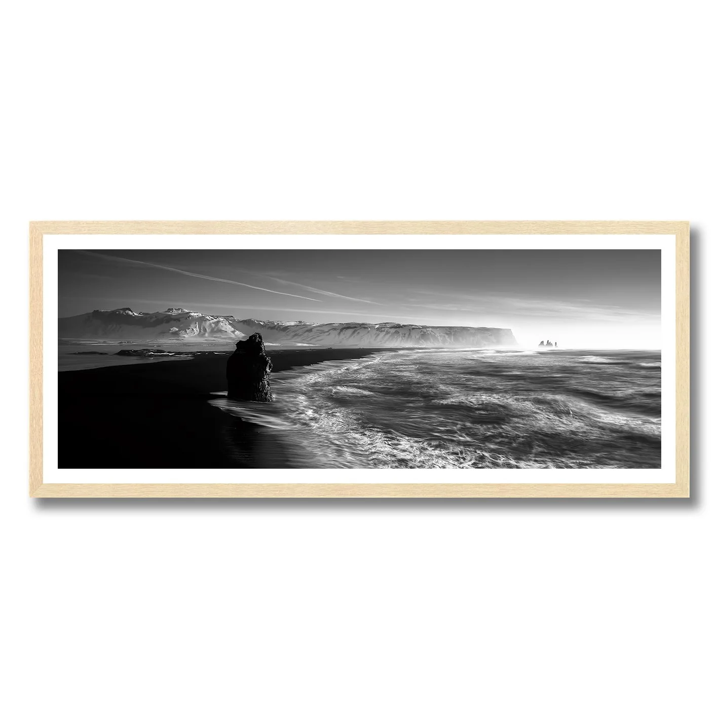 Black and white fine art photograph of Reynisfjara Beach waves and cliffs in Iceland