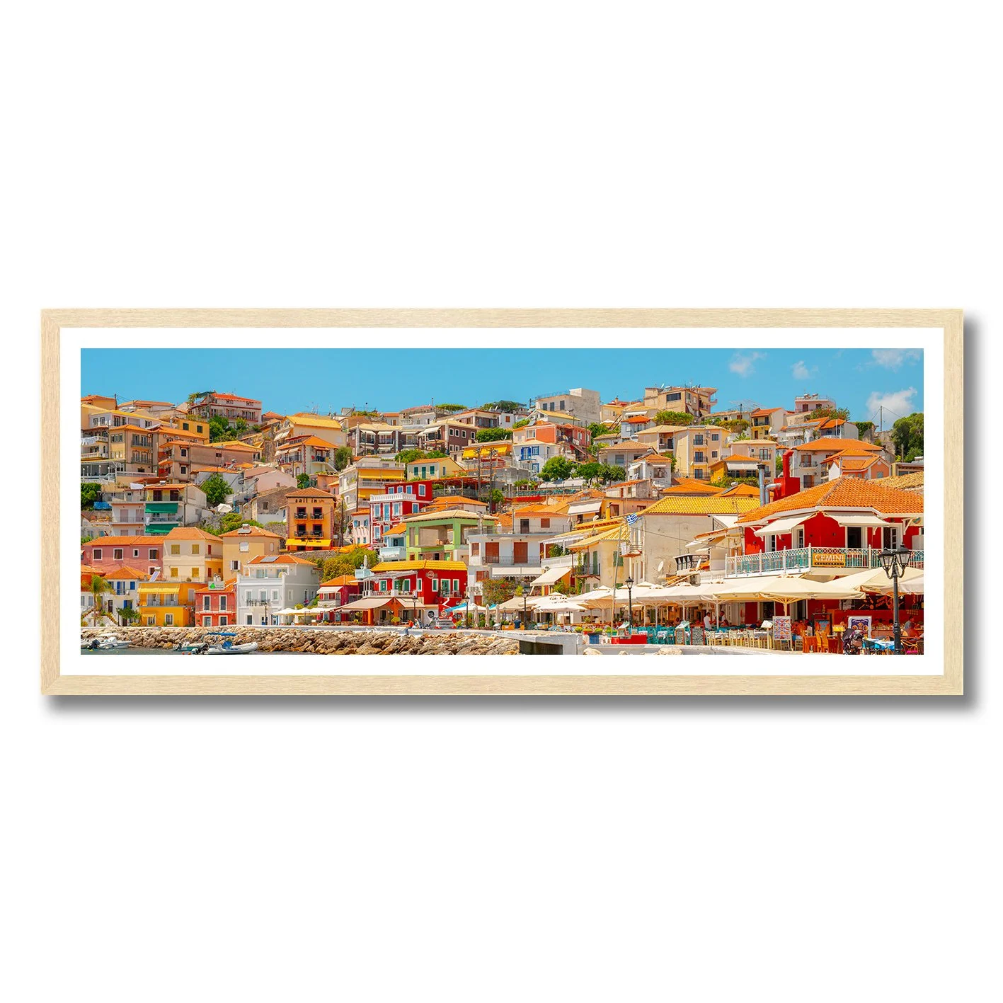 fine art photograph of colourful hillside buildings in parga greece under clear blue sky