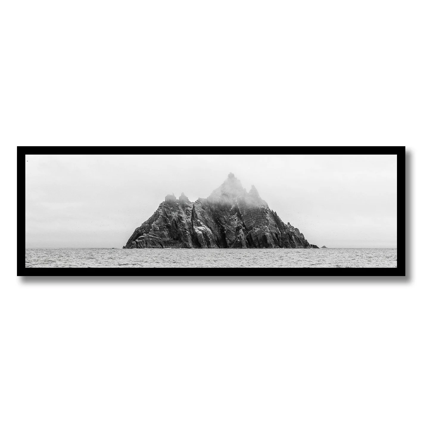 black and white photograph of skellig michael island rising from the atlantic ocean