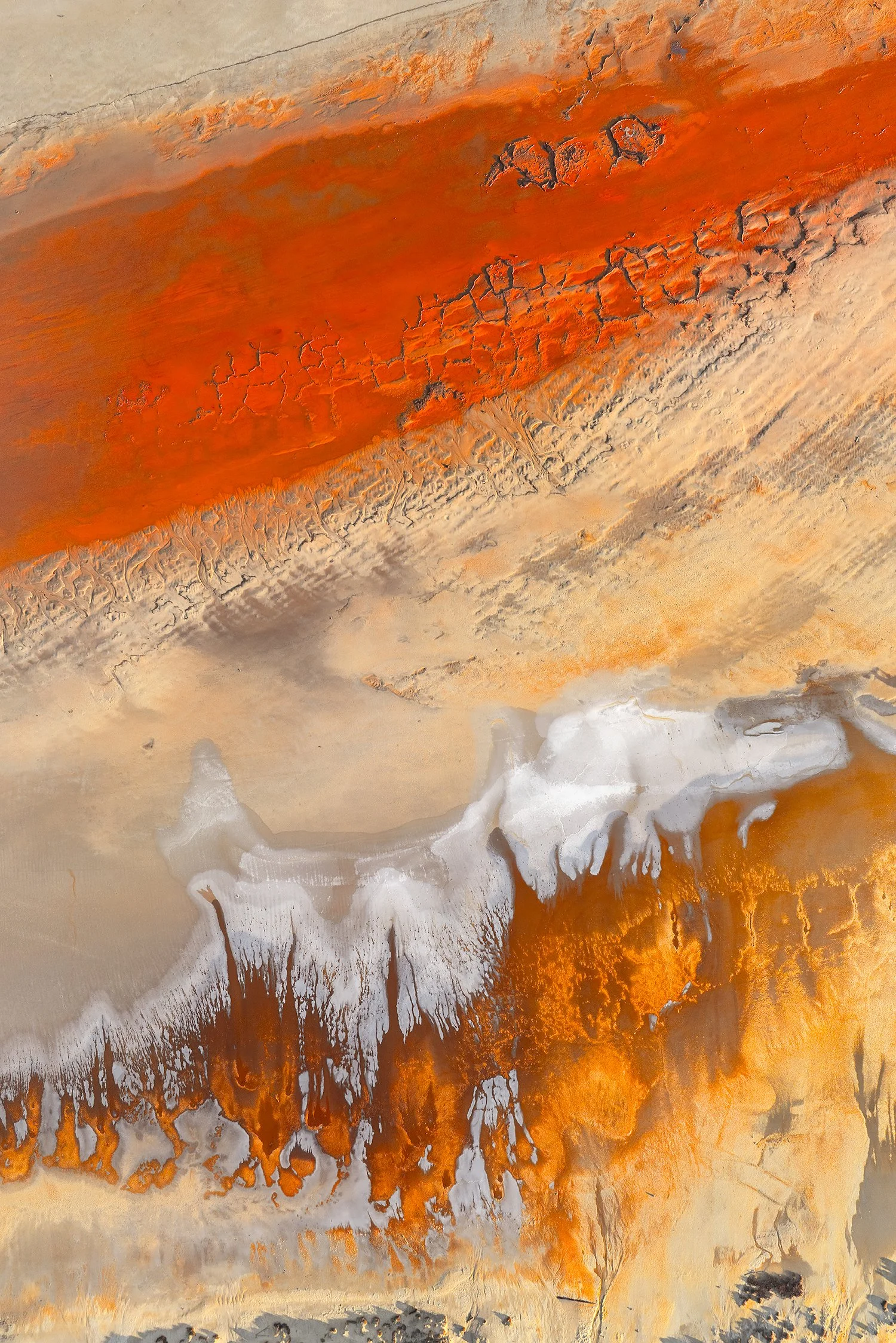 Abstract aerial salt lake textures with orange and white tones, fine art photograph