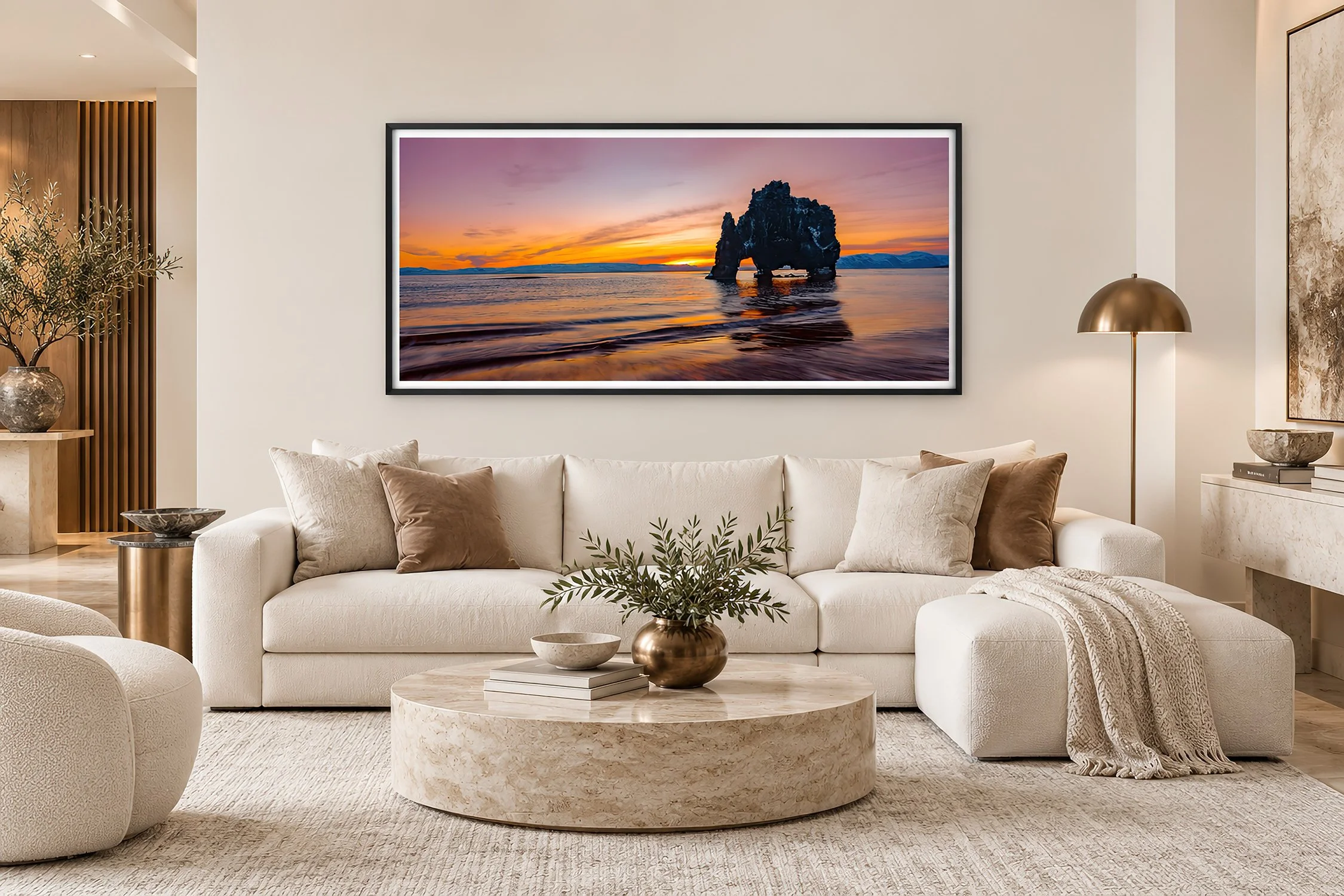 Hvitserkur Iceland sunset fine art photography print in a black frame above a white sofa.