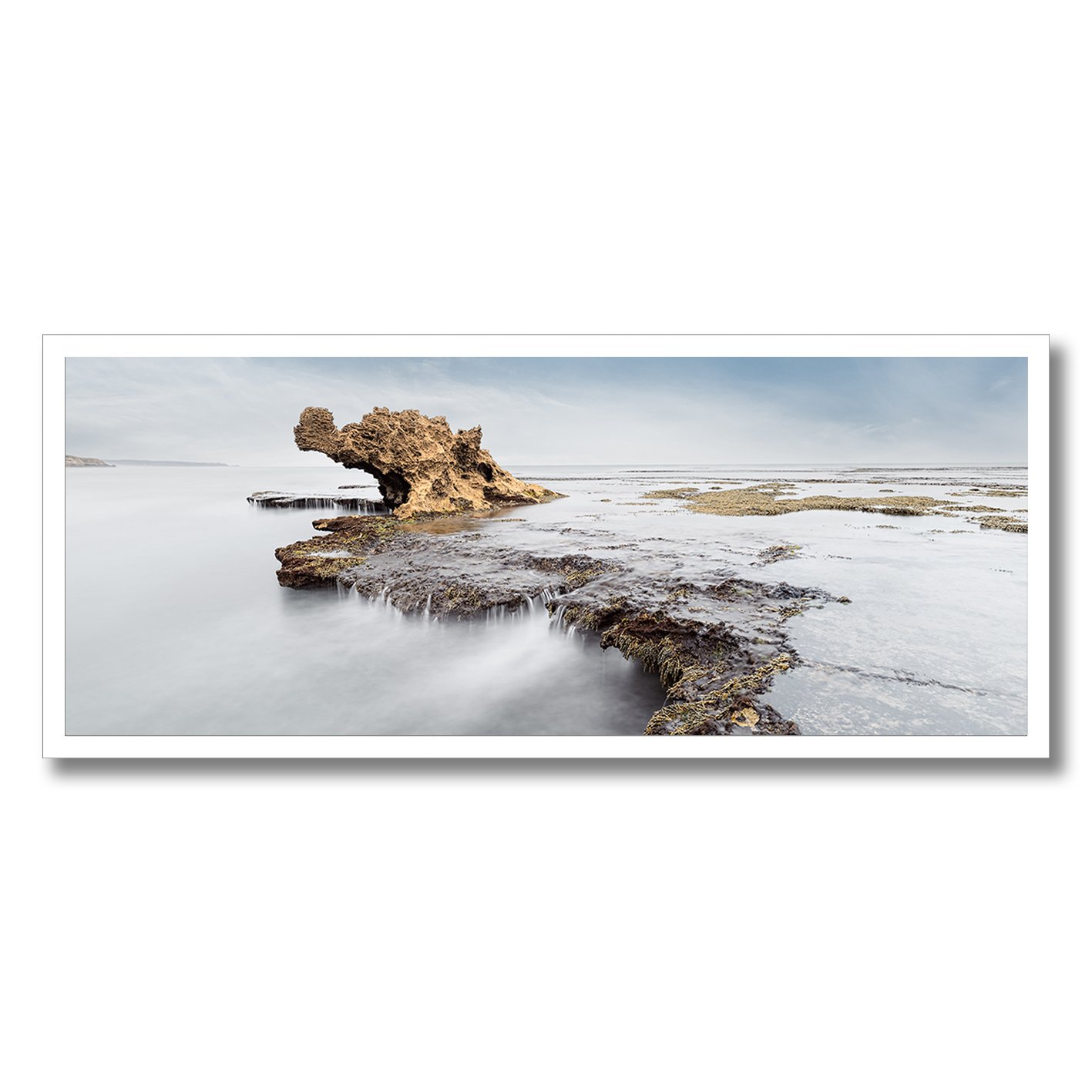 fine art photograph of dragons head rock formation mornington peninsula with soft water motion