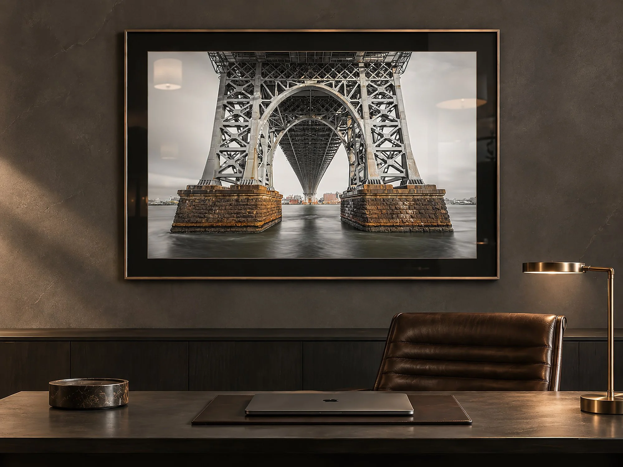 Bridge photograph in a black-matted frame on a charcoal study wall above a minimalist desk, with warm natural light and dark leather furnishings, by Nick Psomiadis at NIKART Studio and Gallery