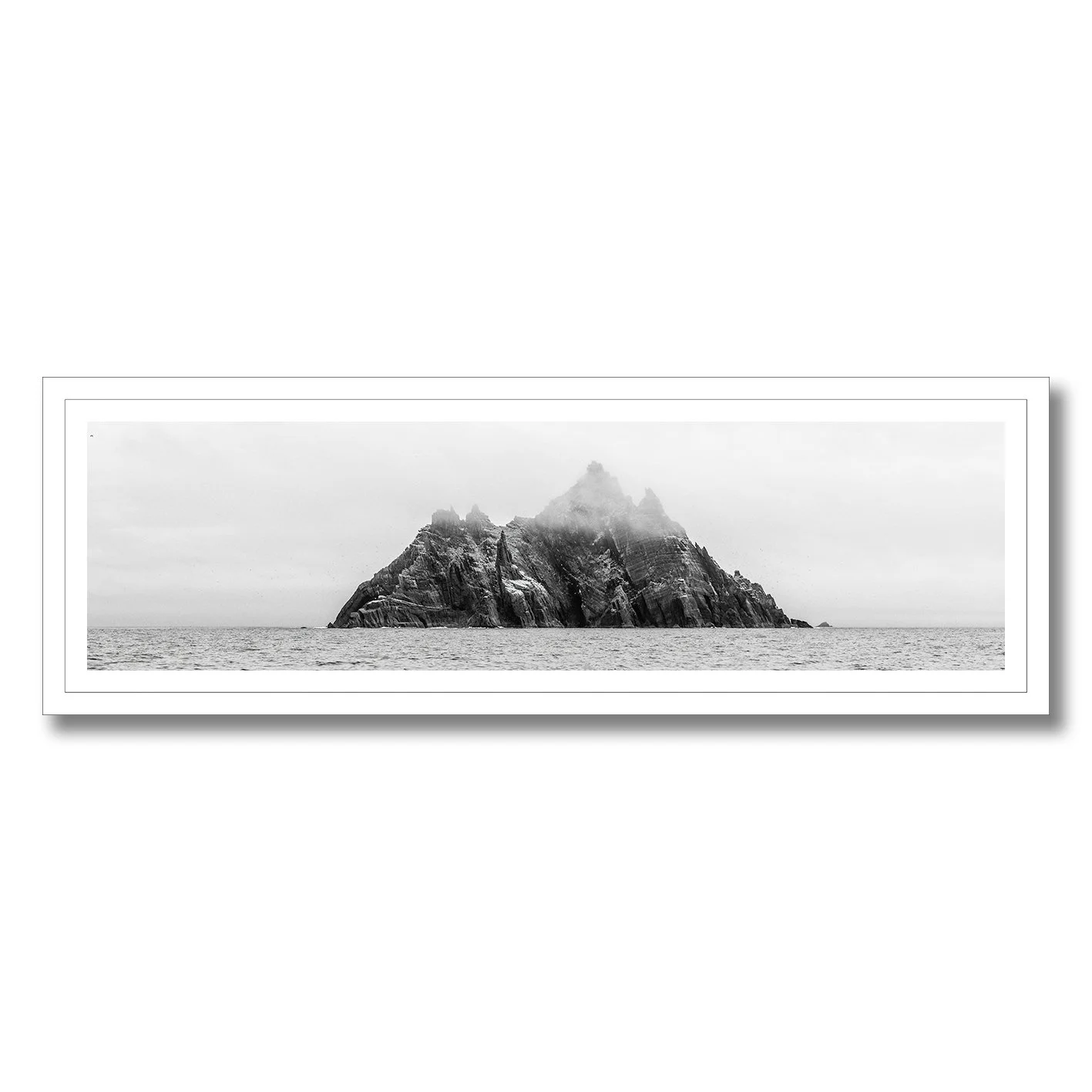 black and white photograph of skellig michael island rising from the atlantic ocean