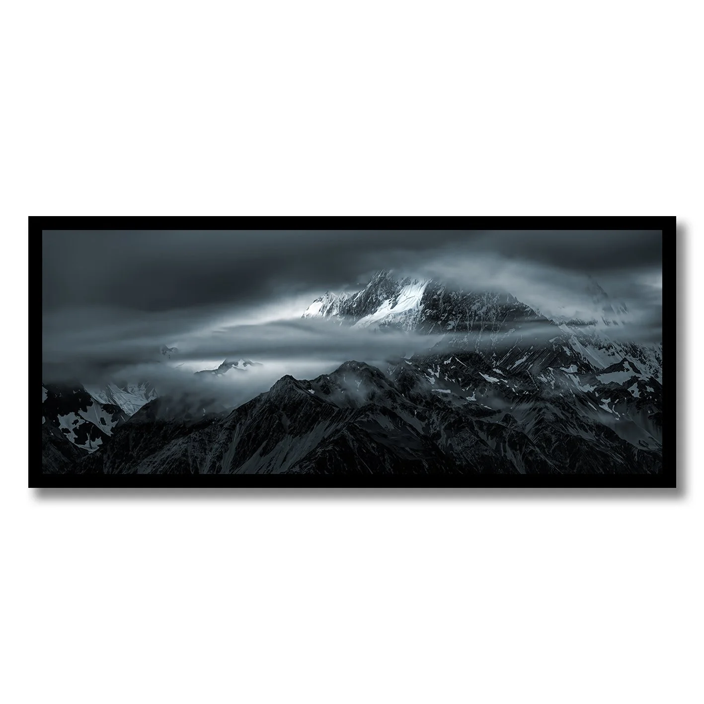 Moody photograph of snow-covered Southern Alps and drifting cloud near Glentanner