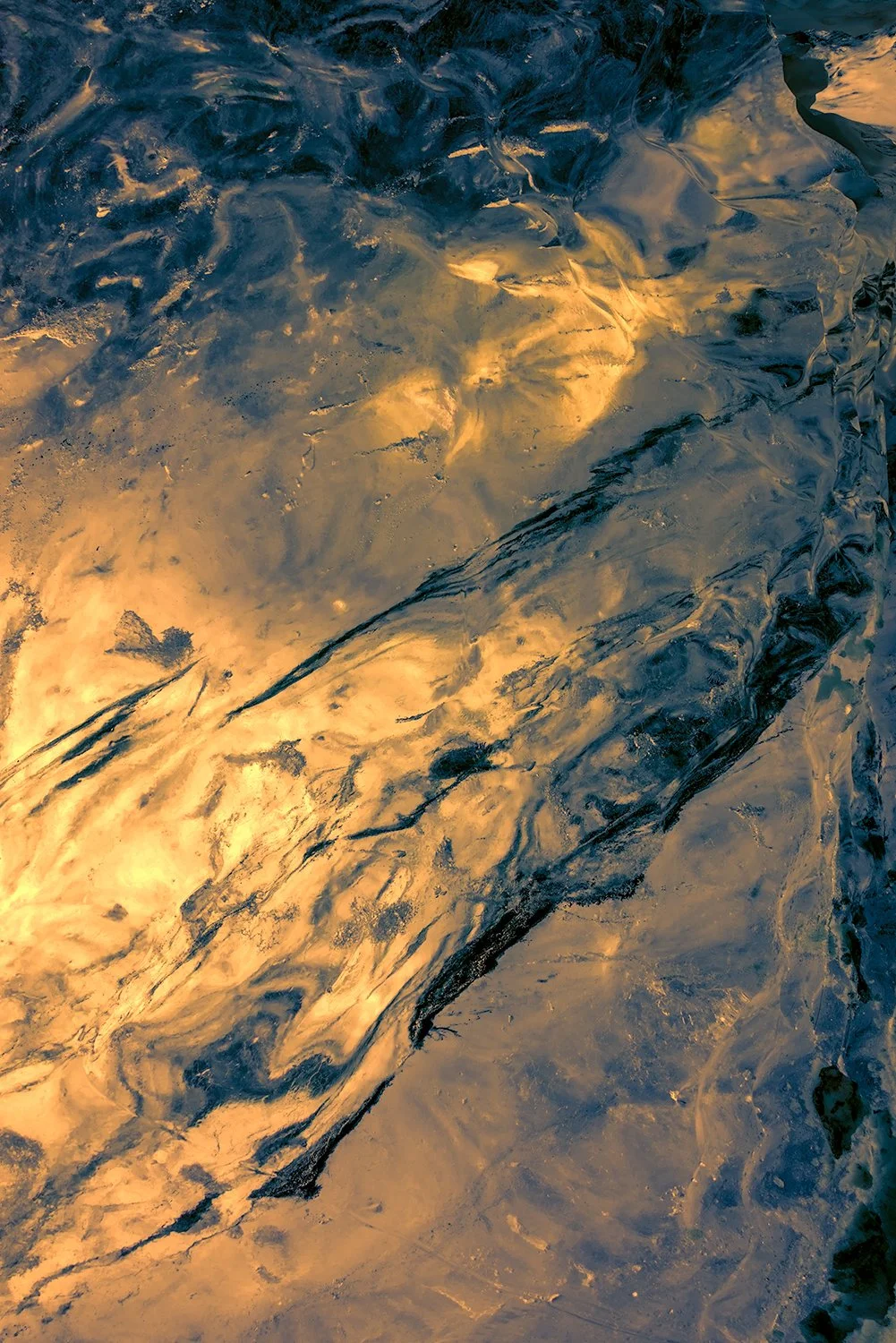Abstract ice textures with golden light, Vatnajökull glacier Iceland photograph