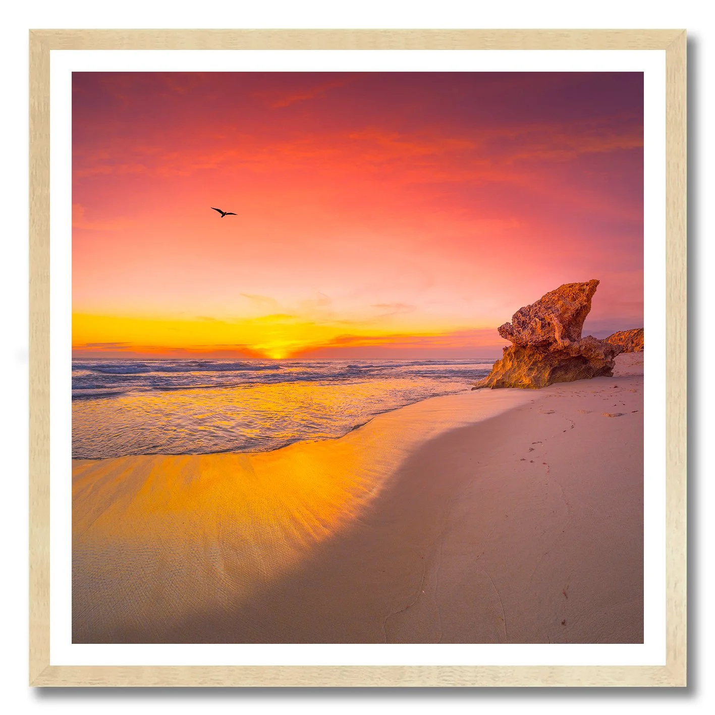 sunset photograph of rye back beach with glowing sand and rock